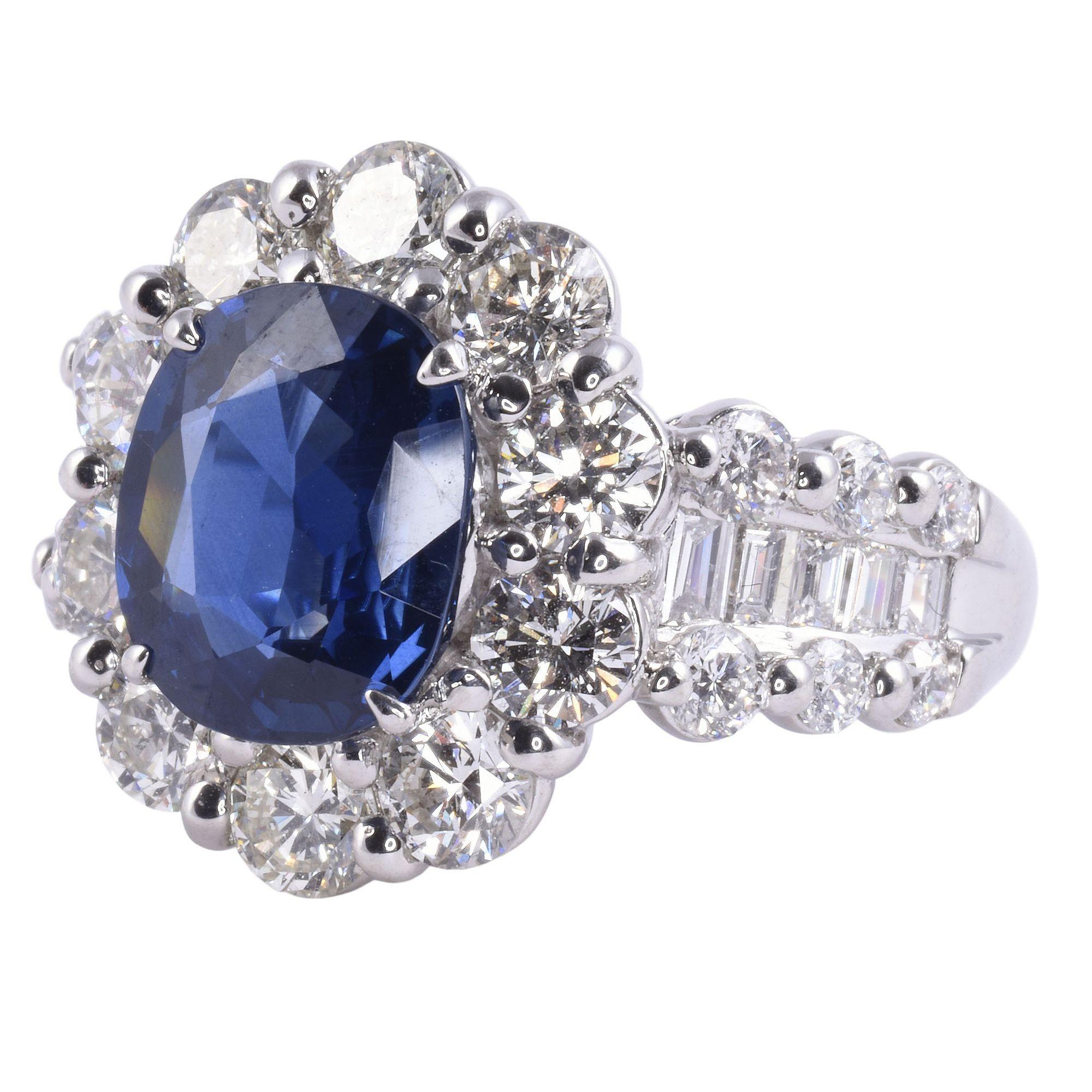 Estate 3.45 carat sapphire & 2.95 CTW diamond platinum ring. This estate platinum ring features a 3.45 carat oval sapphire. The sapphire ring is accented with 2.95 carat total weight of round brilliant and baguette diamonds. This sapphire platinum