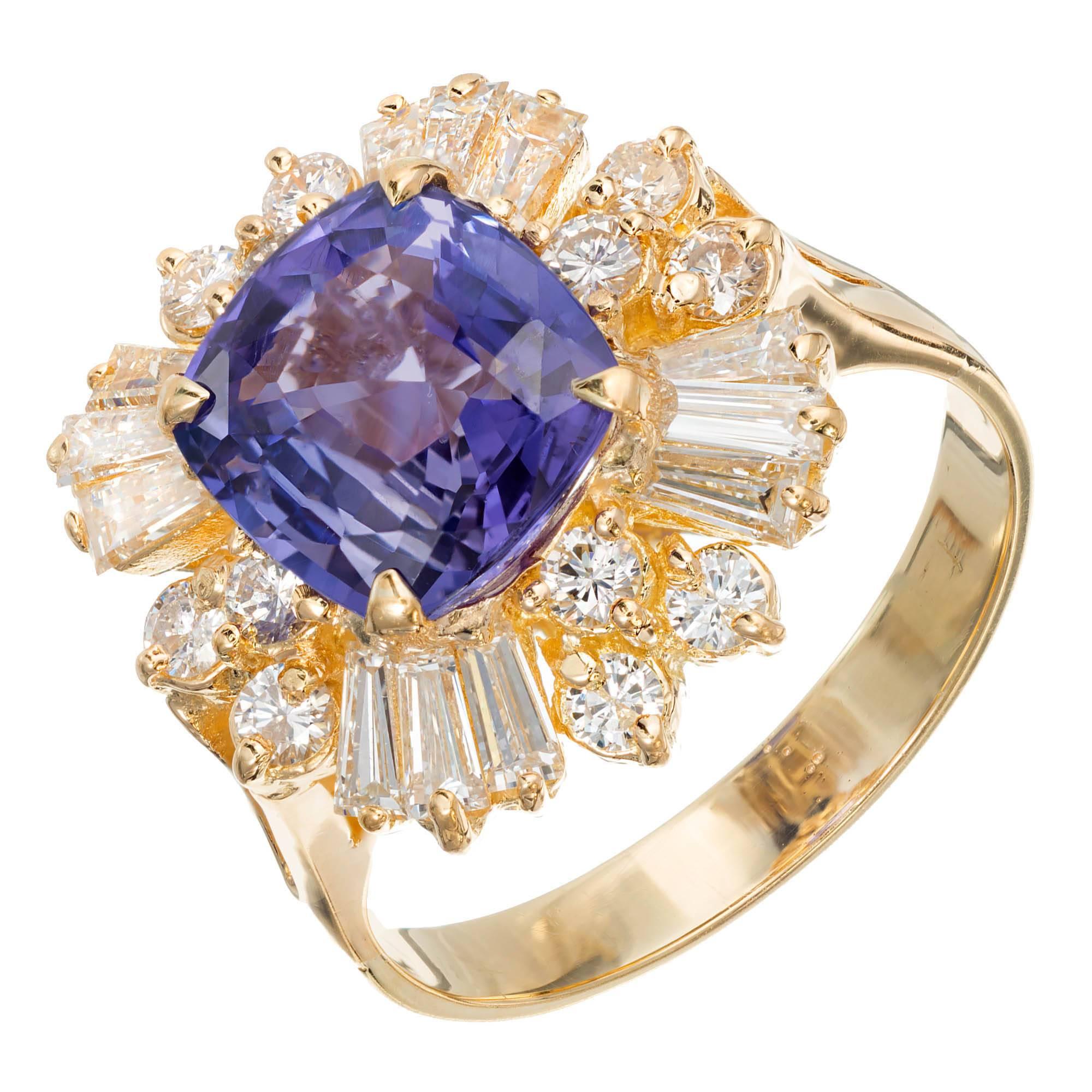 Vintage 1950-1960 Princess style handmade color change sapphire and diamond 18k yellow gold engagement ring. Set with a beautiful GIA certified 3.45 carat cushion cut sapphire that changes color from violet to purple. Round and baguette diamond halo