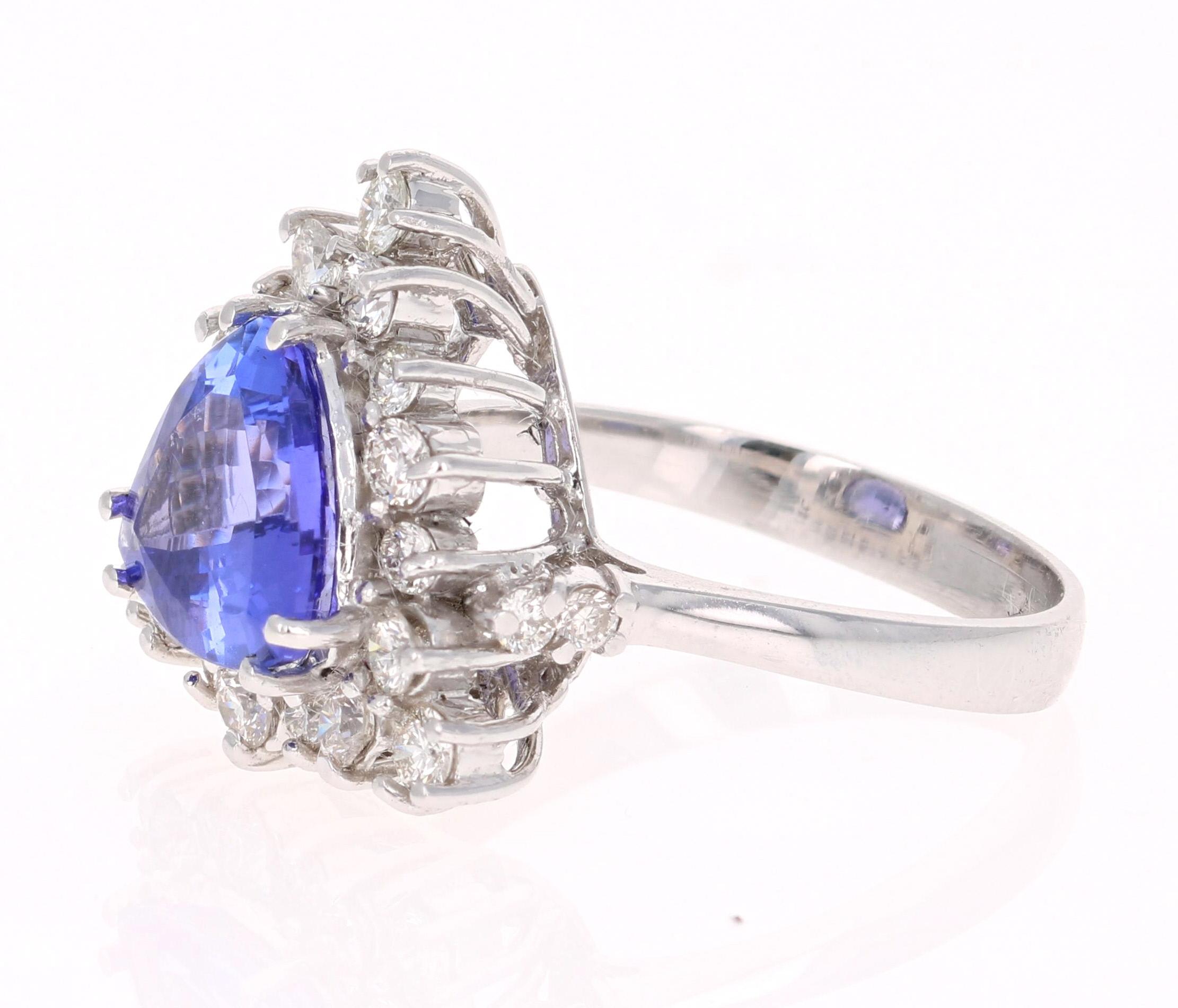 This ring has a natural Trillion Cut Tanzanite that weighs 2.60 Carats. It is surrounded by 22 Round Cut Diamonds that weigh 0.85 Carats. The total carat weight of the ring is 3.45 carats.
The Tanzanite measures at 9.5 mm x 9 mm. 
Elegantly set in