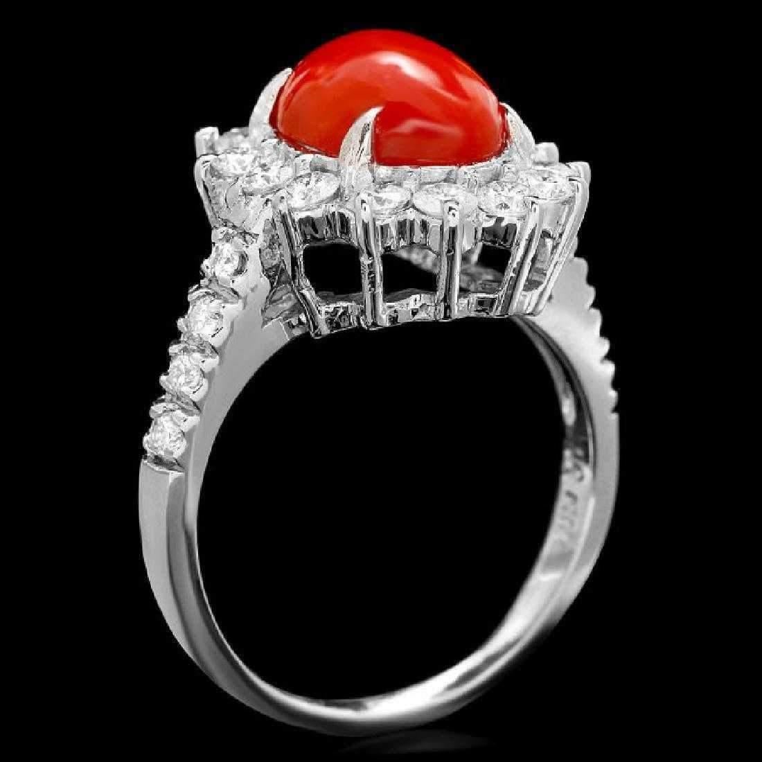 3.45 Carats Impressive Coral and Diamond 14K White Gold Ring

Total Natural Oval Coral Weight is: Approx. 2.50 Carats

Coral Measures: Approx. 10.00 x 8.00mm

Natural Round Diamonds Weight: Approx. 0.95 Carats (color G-H / Clarity SI1-SI2)

Ring