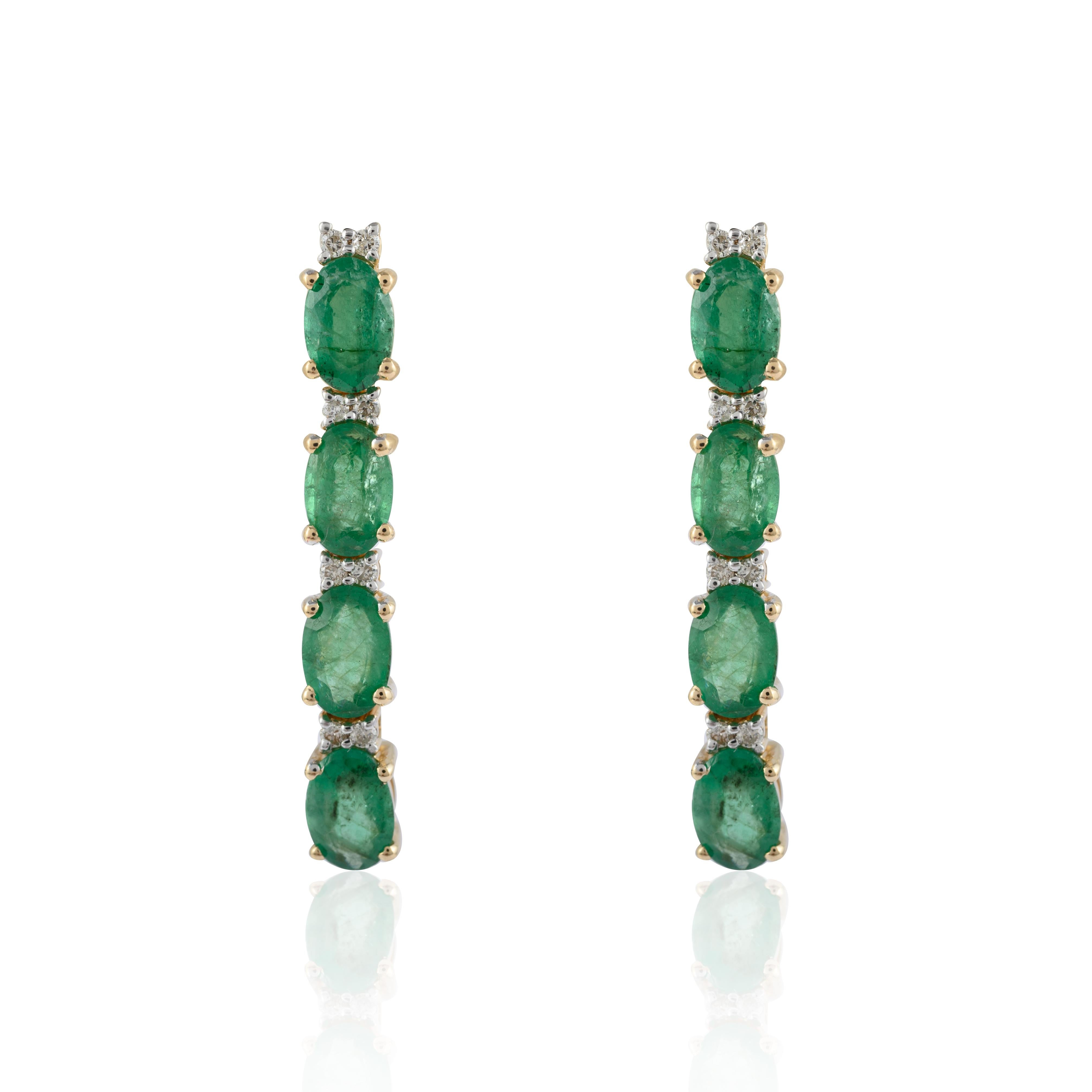Emerald Long Hanging Earrings in 14K Gold to make a statement with your look. These earrings create a sparkling, luxurious look featuring oval cut gemstone.
Emerald enhances the intellectual capacity. 
Designed with alternate oval emerald and