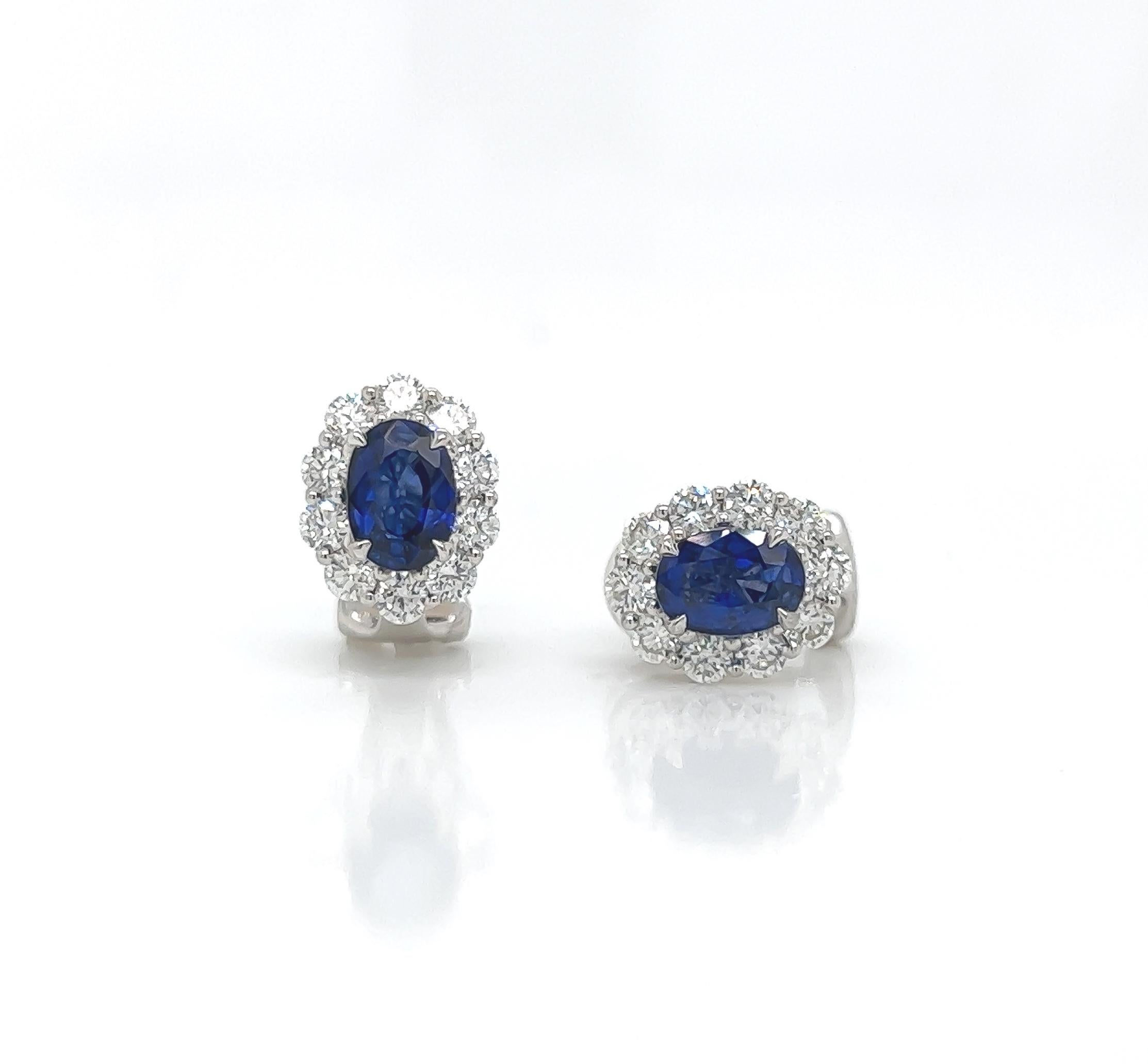 3.45 Total Carat Sapphire and Diamond Earrings in 18K White Gold

This gorgeous pair of sapphire earrings are sure to draw all eyes on you. It is created with a single 2.15 Carat Oval Sapphire, surrounded by a halo of round cut diamonds totaling a