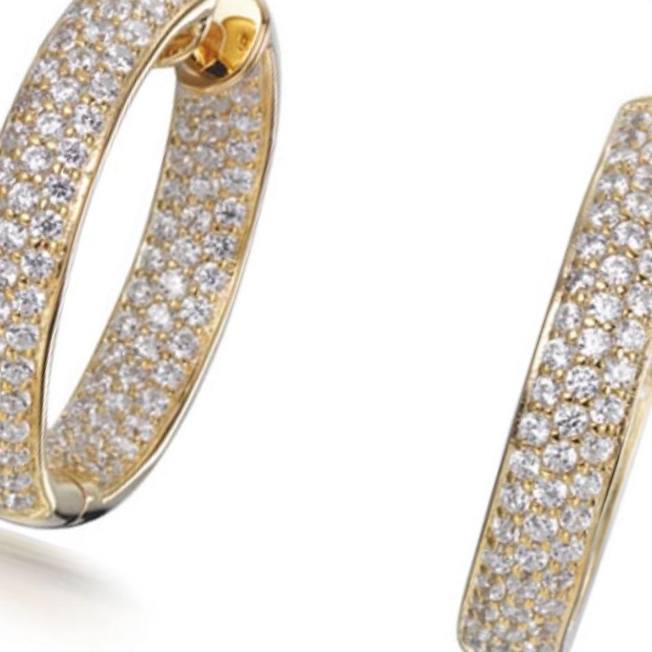 A dazzling pair of hoop earrings, effortless to wear, adding a hint of glamour to any occasion.

Featuring 3.45ct of round brilliant cut cubic zirconia, micro set into 925 sterling silver with a 14kt yellow gold finish.

Dimensions: 20mm wide x 24mm