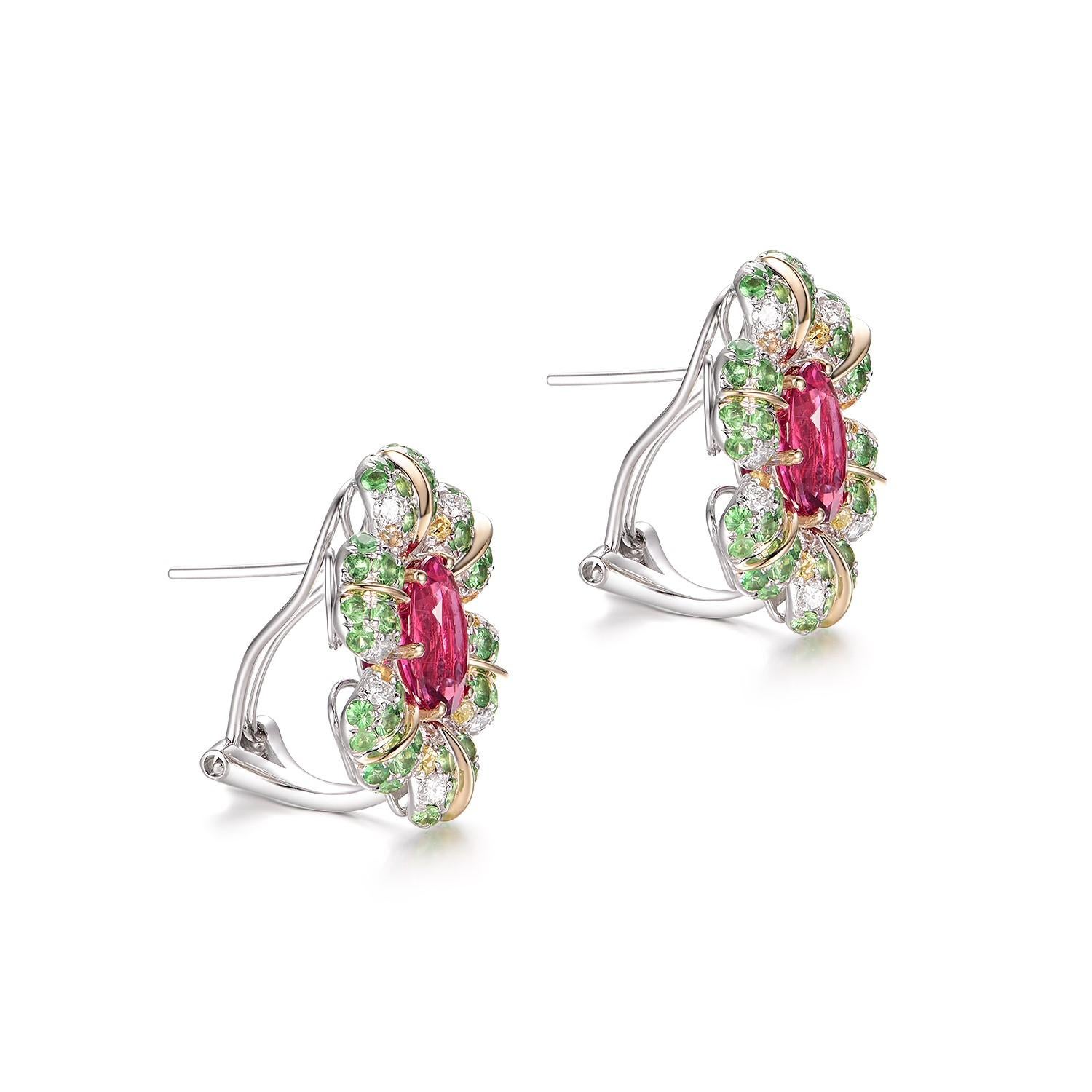 The earrings you've presented exhibit a magnificent 
Set in 14K Yellow Gold, these earrings are adorned with a central Rubellite, known for its striking and vivid reddish-pink hue. Weighing 3.45 carats, the Rubellites are the stars of this piece.