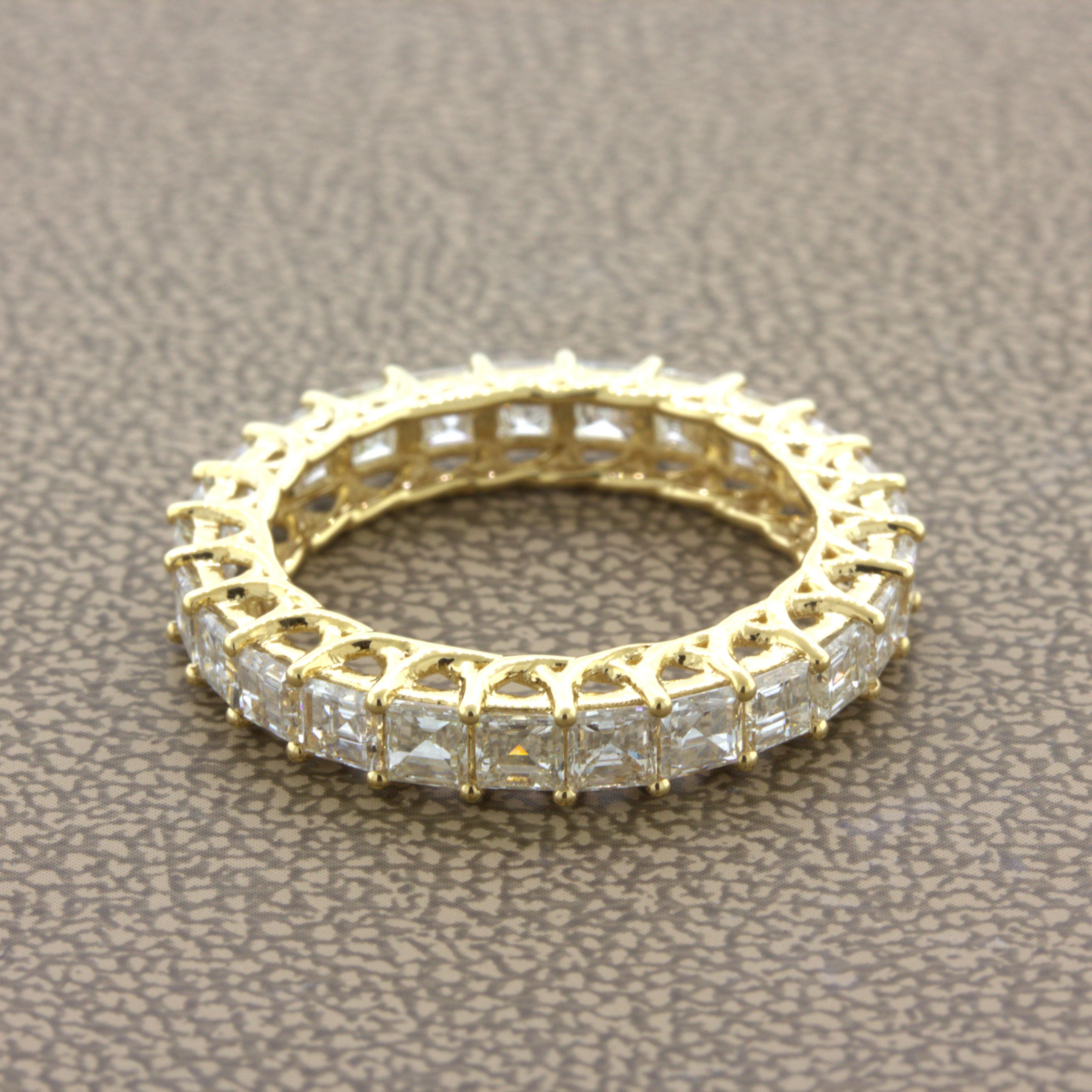 A sleek and elegant eternity band featuring bright white asscher-cut diamonds! The diamonds weigh a total of 3.46 carats and have VS clarity and F-G color, top quality matching stones. They are set in 18k yellow gold, and the ring is ready to be