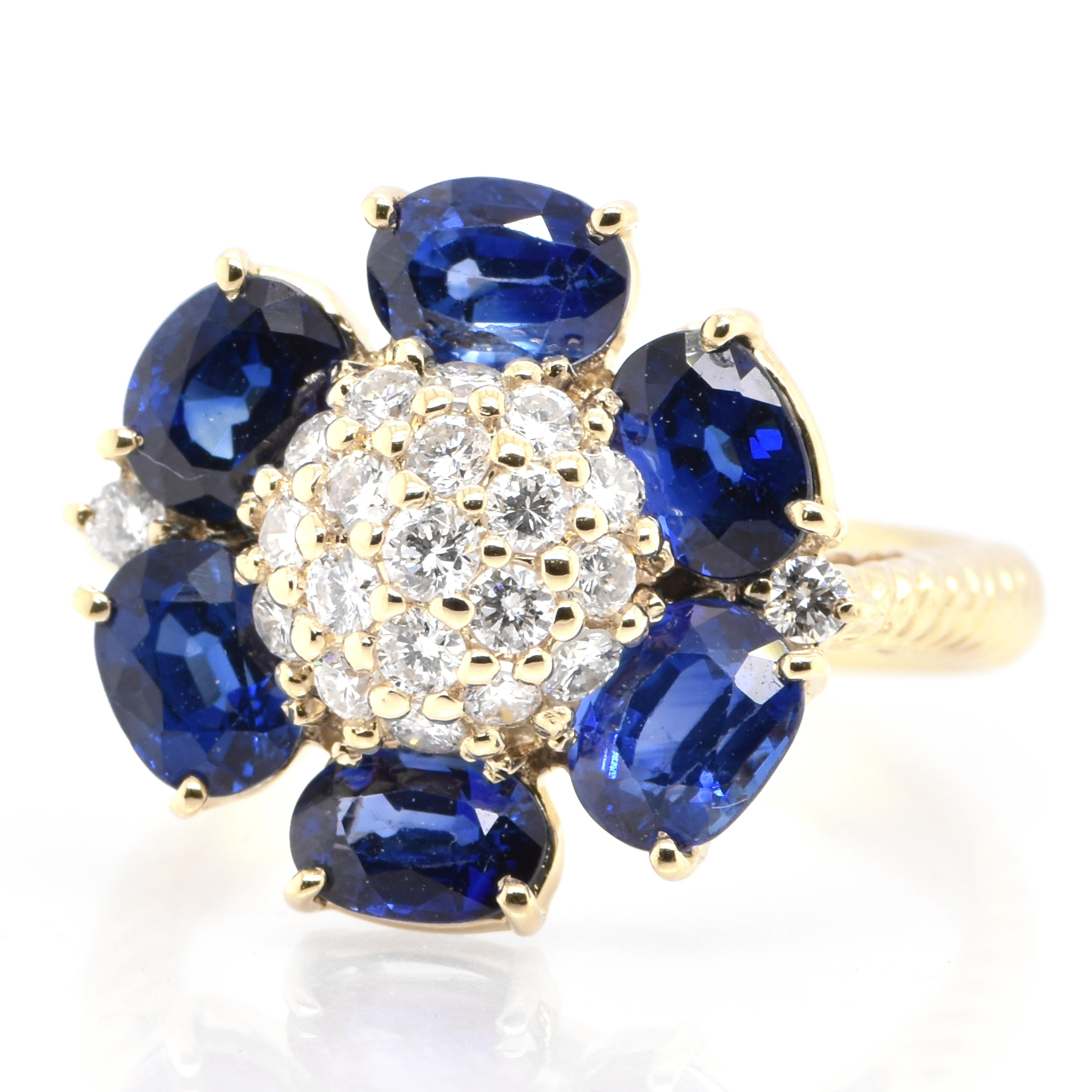 A beautiful Cluster ring featuring 3.46 Carat, Natural Sapphire and 0.45 Carats Diamond Accents set in 18 Karat Gold. Sapphires have extraordinary durability - they excel in hardness as well as toughness and durability making them very popular in