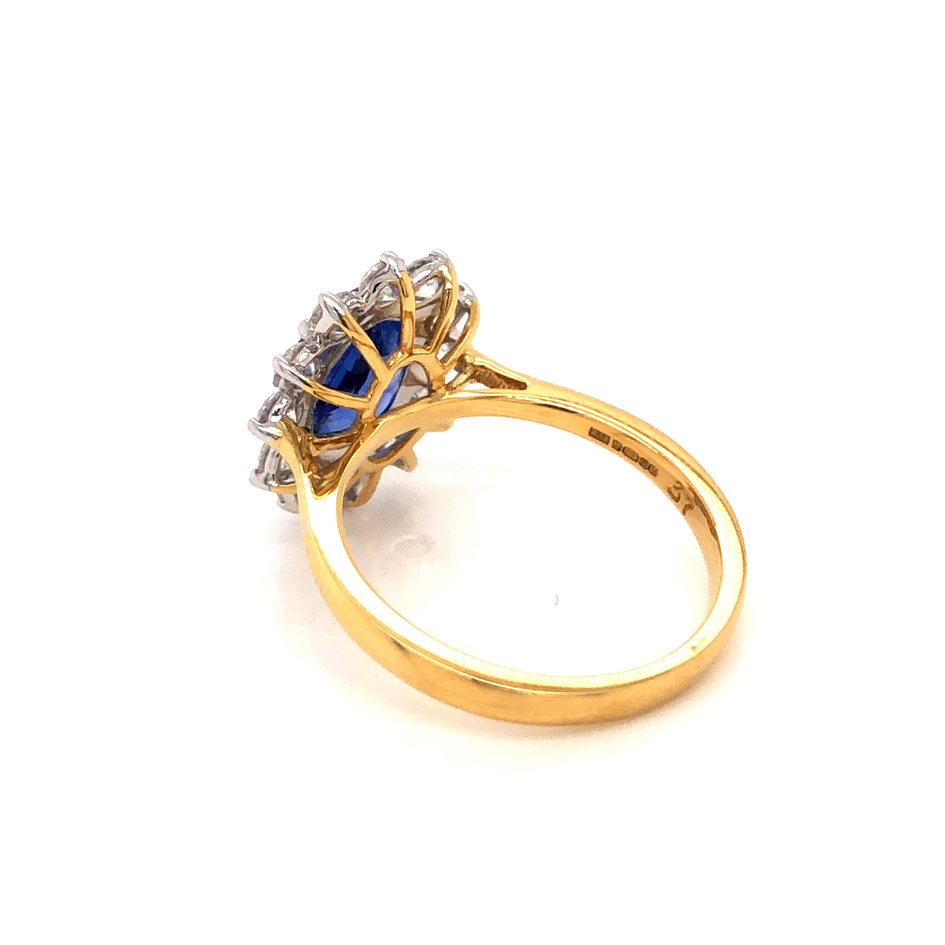 An impressive 3.46 carat total gem weight, 2.46  carat Blue Sapphire Dress / Engagement Ring surrounded by a claw set diamond halo With a total diamond weight of 0.99 carat white colour G, clarity VS / SI round brilliant cut diamonds. 

This Ring