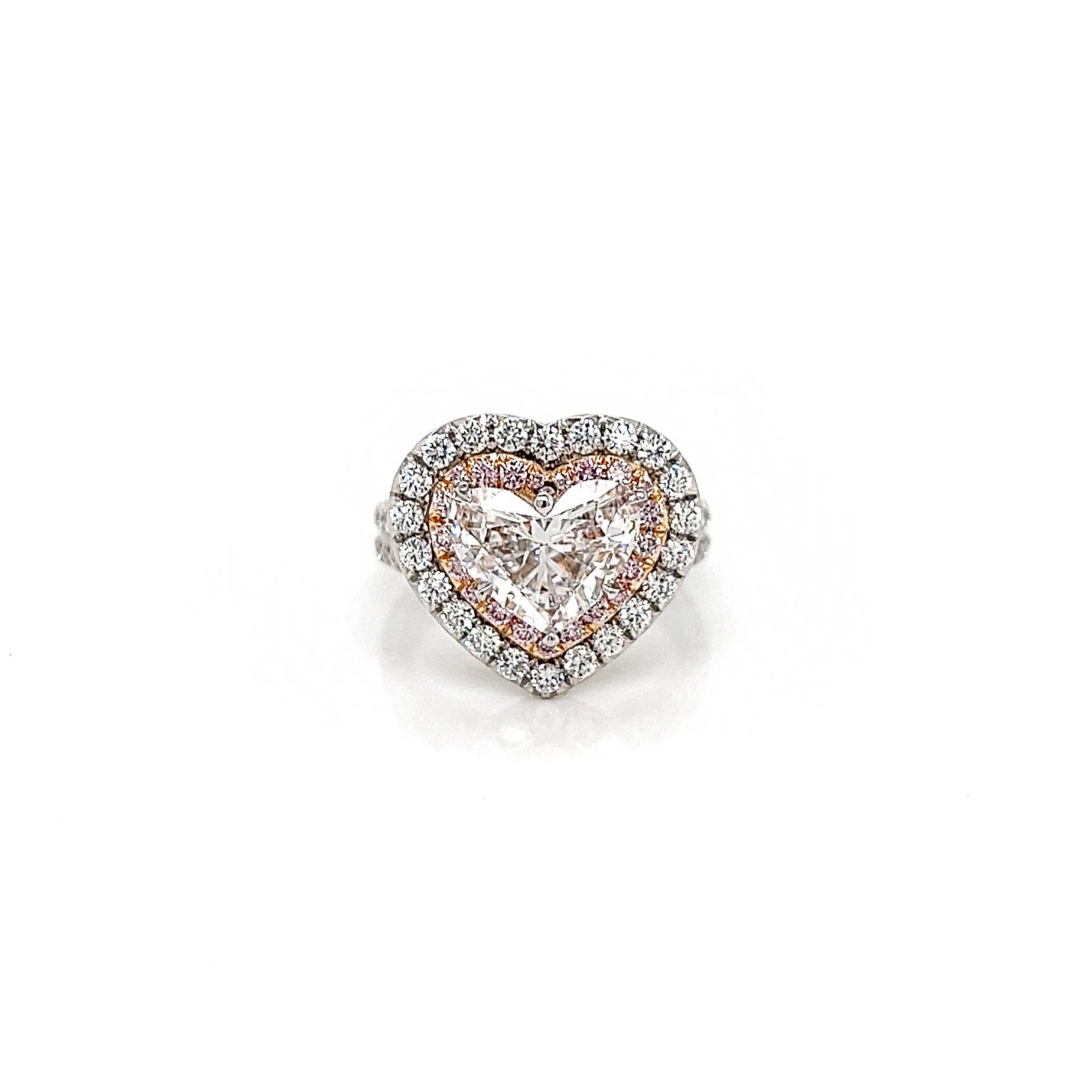 3.46 Total Carat Diamond Heart-Shaped Double Halo Pave-Set Ladies Engagement Ring. GIA Certified 

This ring will make you stand out from the crowd. The unique duo qualities in the color and cut of the center diamond will make you struggle to swat