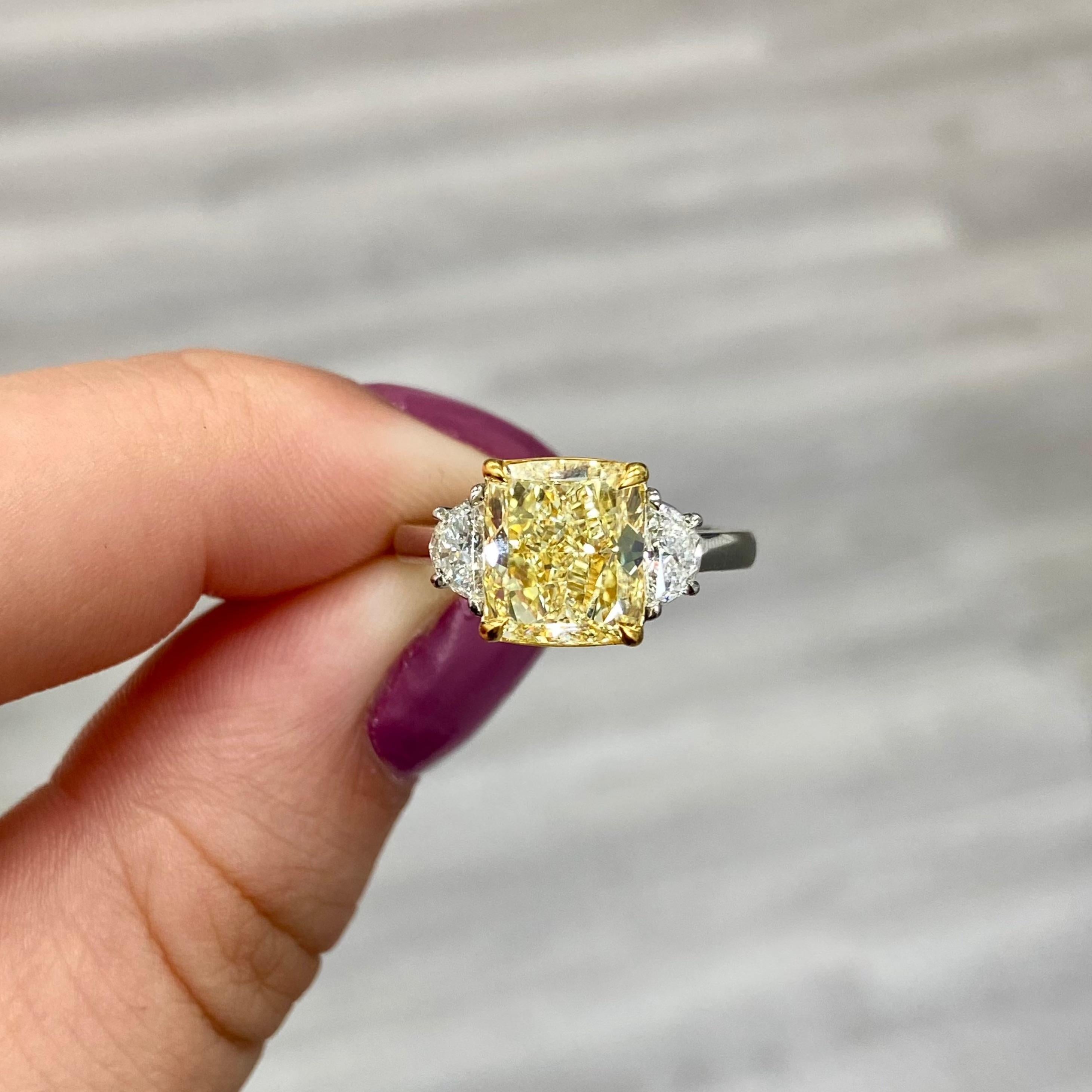 Well laid out and lively Fancy Yellow Cushion set in Platinum and 18kt Yellow Gold with 0.40ct of D VS Half Moons
Off square shape
