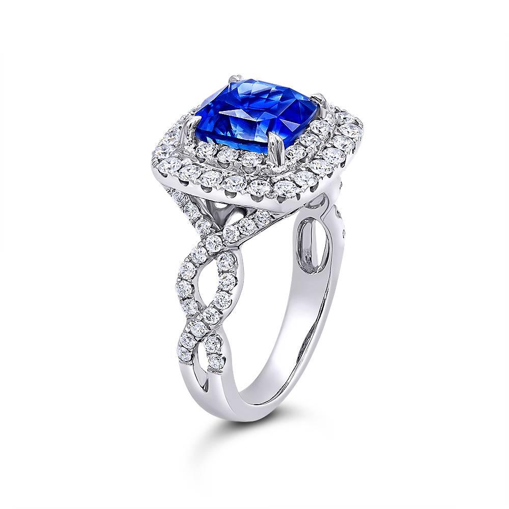 Blue Sapphire in a detailed double halo design leading to a twist pave band Handmade in 14K White Gold
Center-stone: Blue sapphire mixed cut 3.47ct, fine quality from Sri Lanka 
Diamond setting: 1.12ct