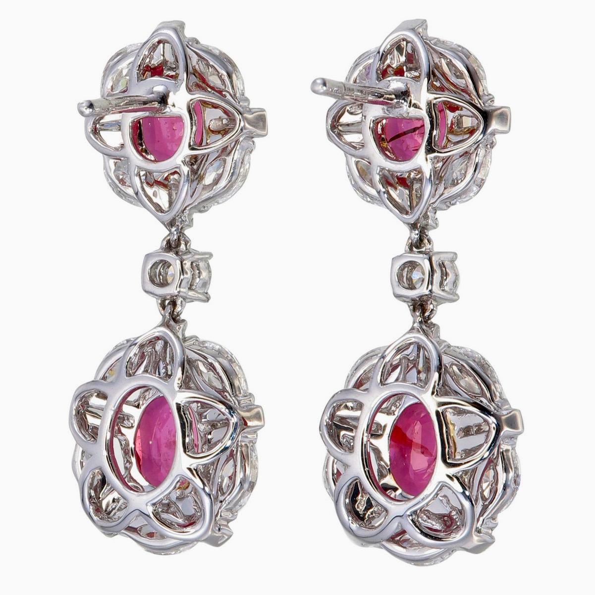 A vibrant and sophisticated ruby and diamond chandelier earrings presented to you by Rewa jewels in 18 karat white gold.

This piece is decorated with 2 pieces of vibrant Mozambique rubies weighing approximately 2.05 carat total and 2 pieces more 