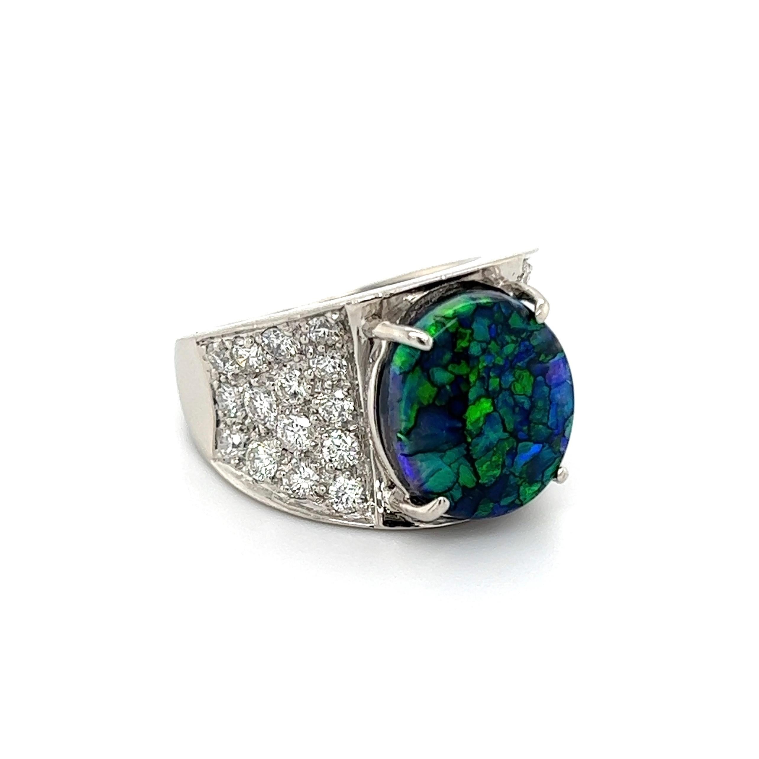 Simply Beautiful! Finely detailed Cocktail Ring, center securely nestled with a Black Harlequin Opal weighing 3.48 Carats, encrusted either side with Hand set Diamonds, approx. 1.33 total carat weight. Hand crafted Platinum mounting. Approx.
