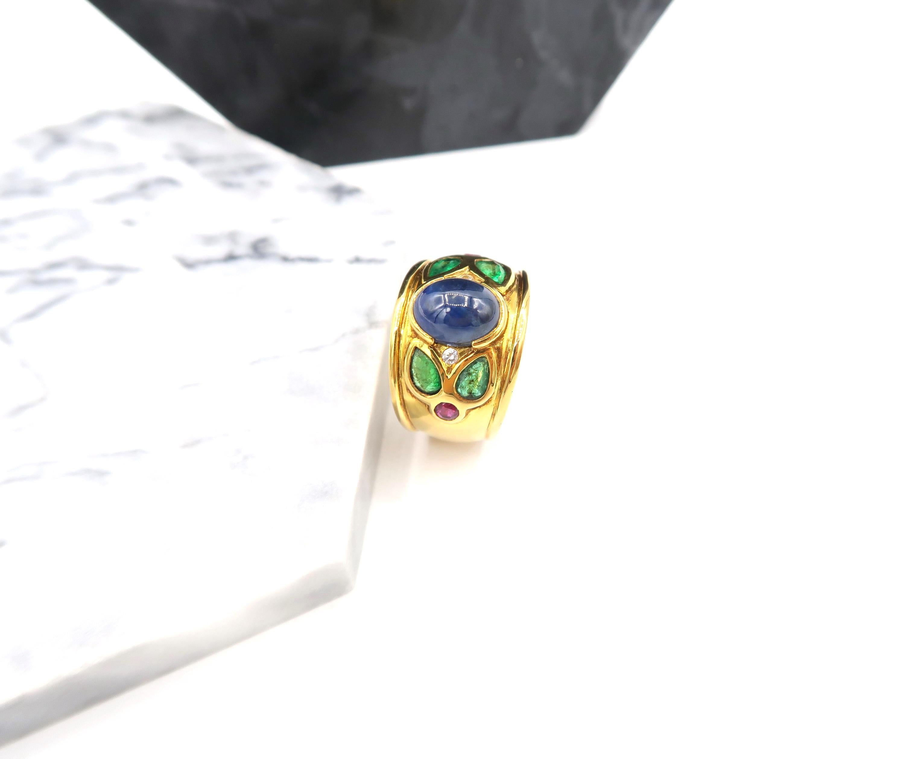 3.48 Carat Cabochon Sapphire 18 Karat Yellow Gold Ring with Diamond, Emerald, Rubies

Please let us know upon checkout should you wish to have the ring resized. 
Ring size: US 7, UK N

Gold: 18K 12.13g.
Diamond: 0.05ct.
Sapphire: 3.58cts.
Emerald: