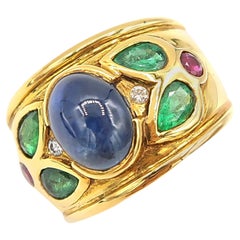 3.48 Carat Cabochon Sapphire 18 Karat Gold Ring with Diamond, Emerald, Rubies