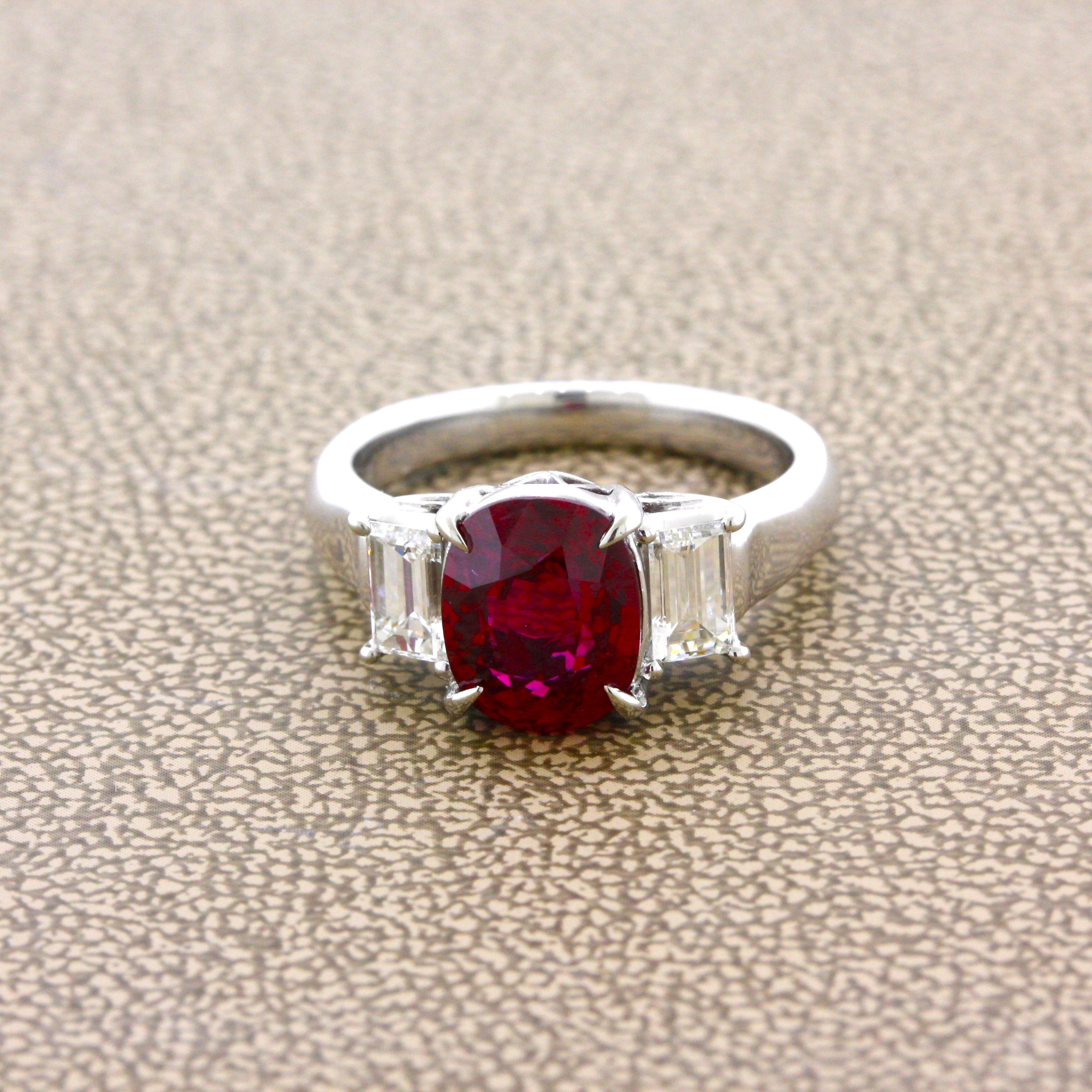 A superb gem quality ruby weighing an impressive 3.48 carats takes center stage. It has the most ideal, brilliant, vivid, and pure red color which seems out of this world. The oval-shaped gem ruby is one of the finest stones we have ever seen. It is