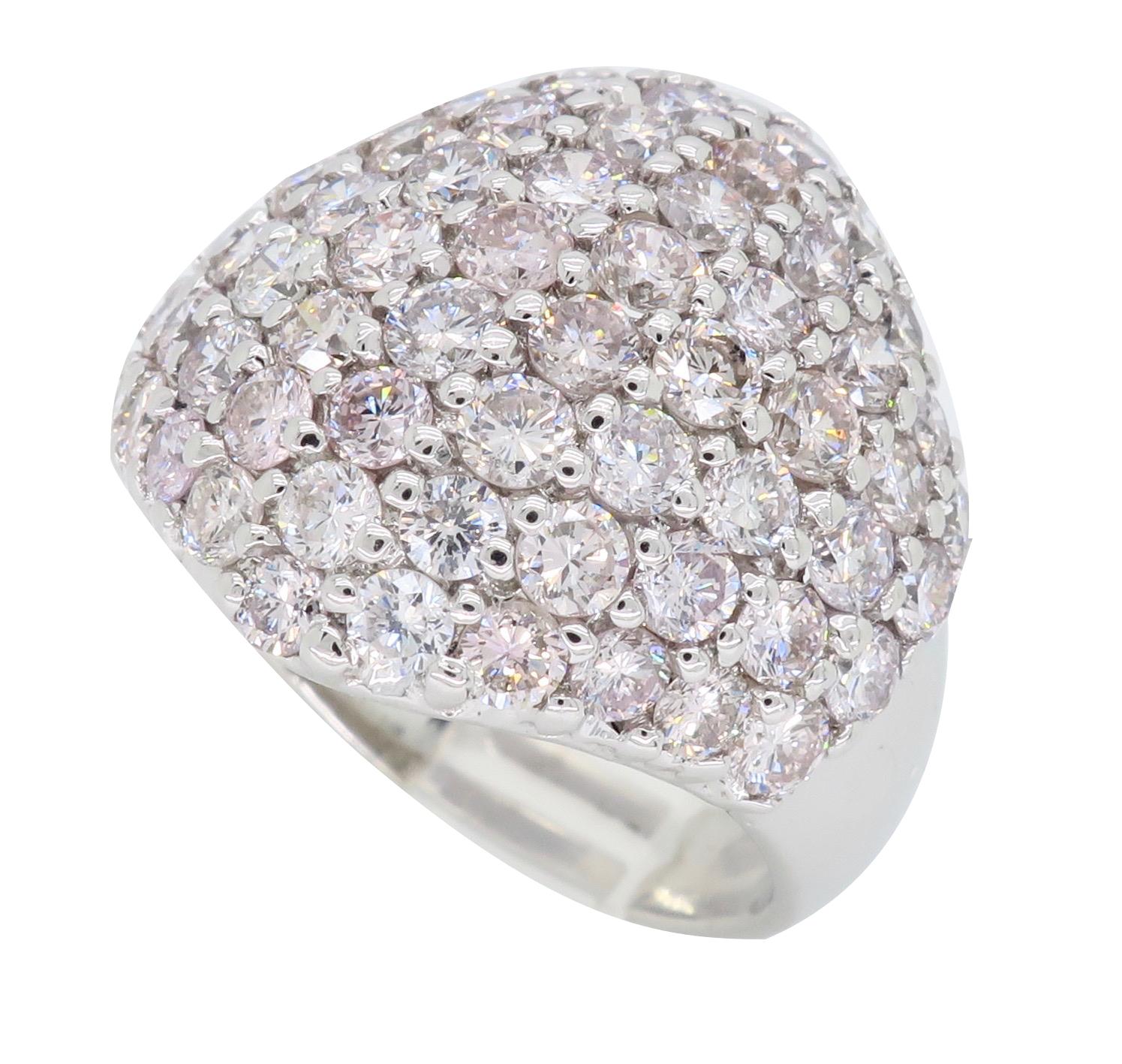 Glamorous light pink diamond cocktail ring set in 14k white gold.

Diamond Cut: Round Brilliant Cut 
Average Diamond Color: Light Pink
Average Diamond Clarity: VS-SI
Diamond Carat Weight:  Approximately 3.48CTW 
Metal: 14K White Gold
Ring Size: