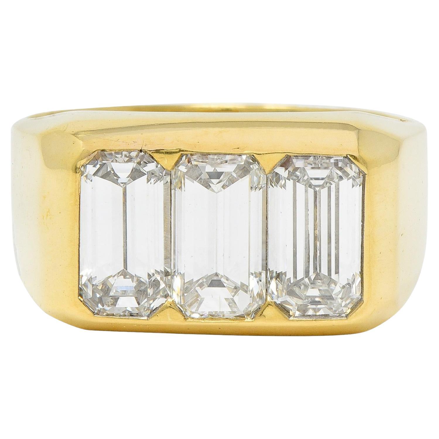 3.48 CTW Flush Emerald Cut Diamond 18 Karat Yellow Gold Vintage Three Stone Ring For Sale