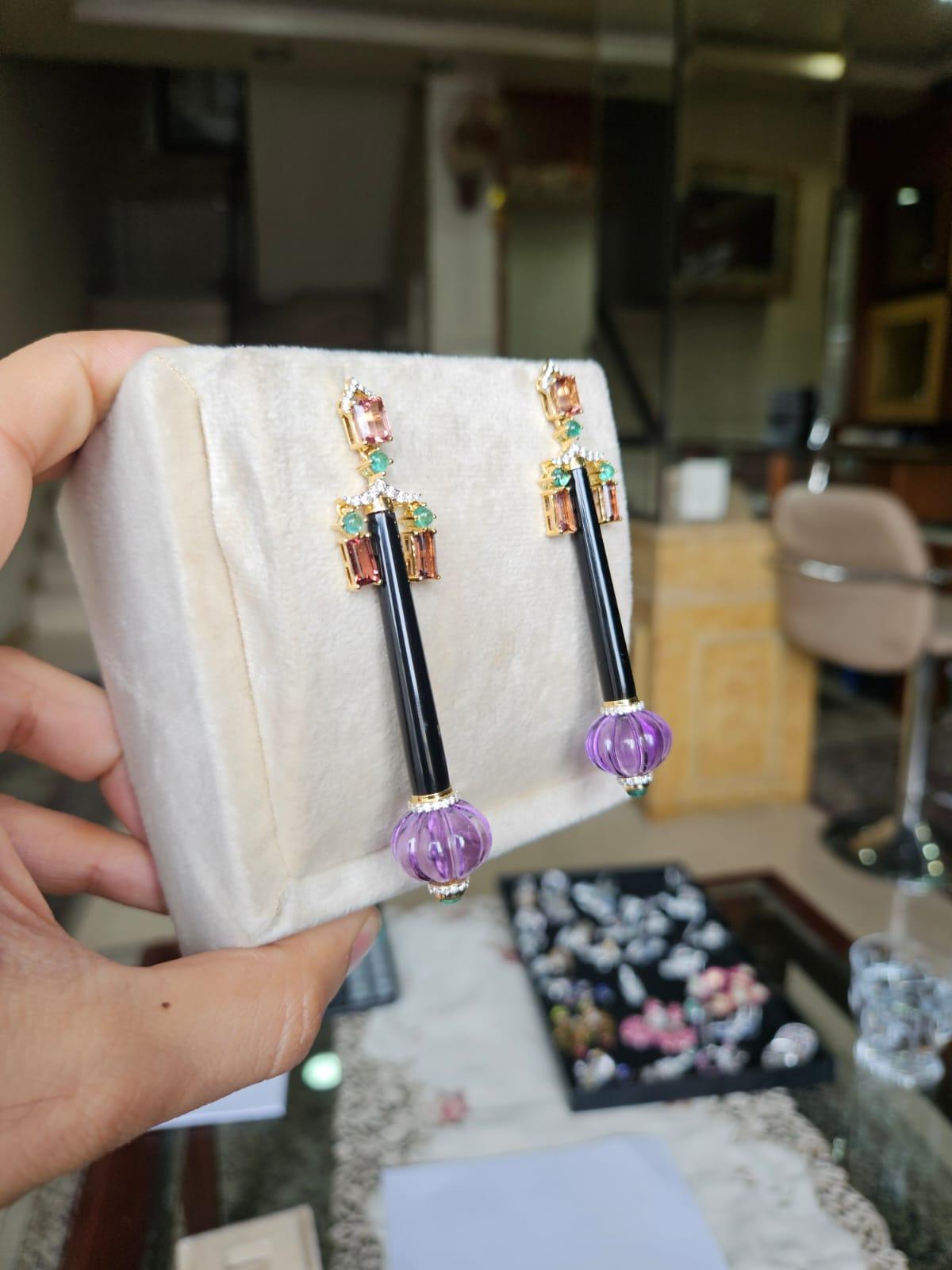 A very gorgeous and beautiful, Art Deco Style, Amethyst, Emerald, Black Onyx & Tourmalines Chandelier Earrings set in 18Kt Gold & natural Diamonds. The weight of the Amethyst 