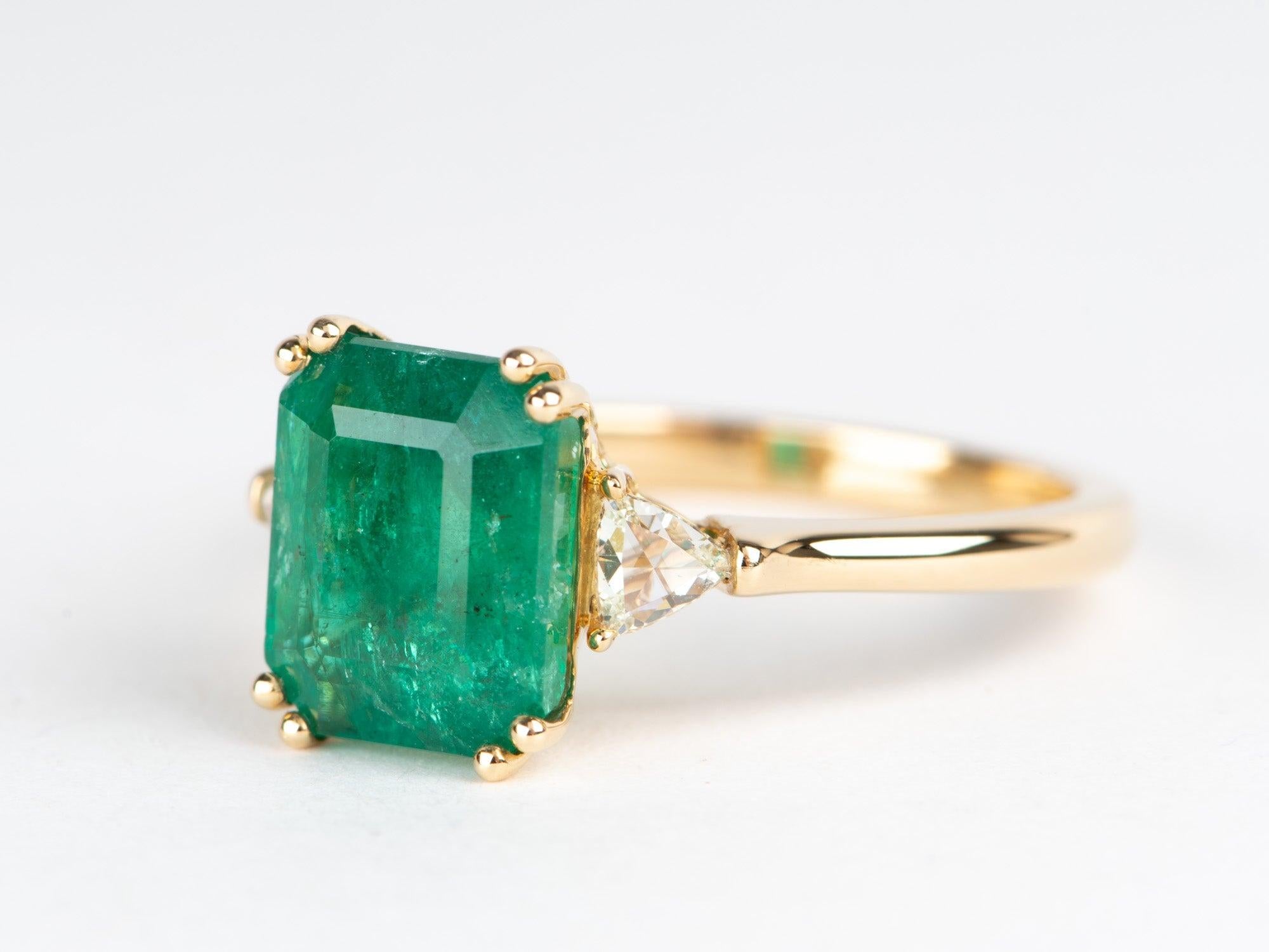   Elevate your style with our 3.22ct Emerald Statement Ring! Featuring a stunning emerald with classic clean lines, this ring is the epitome of luxury! Crafted in solid 14K gold and modern double prongs at each corner of the stone, this ring will