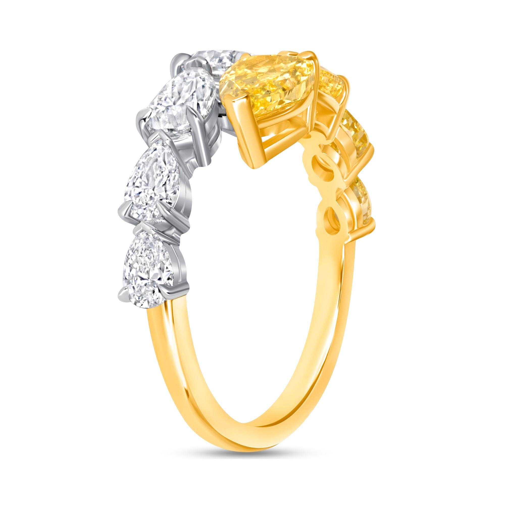 Pear Shape Fancy Intense Yellow Diamond and Pear Shape Diamond ring set in 18K Yellow Gold and Platinum. There are four Fancy Yellow pear shape diamonds weighed  1.87ct and four pear shape diamonds in D to F color, VVS-VS clarity weighed 1.61ct . It