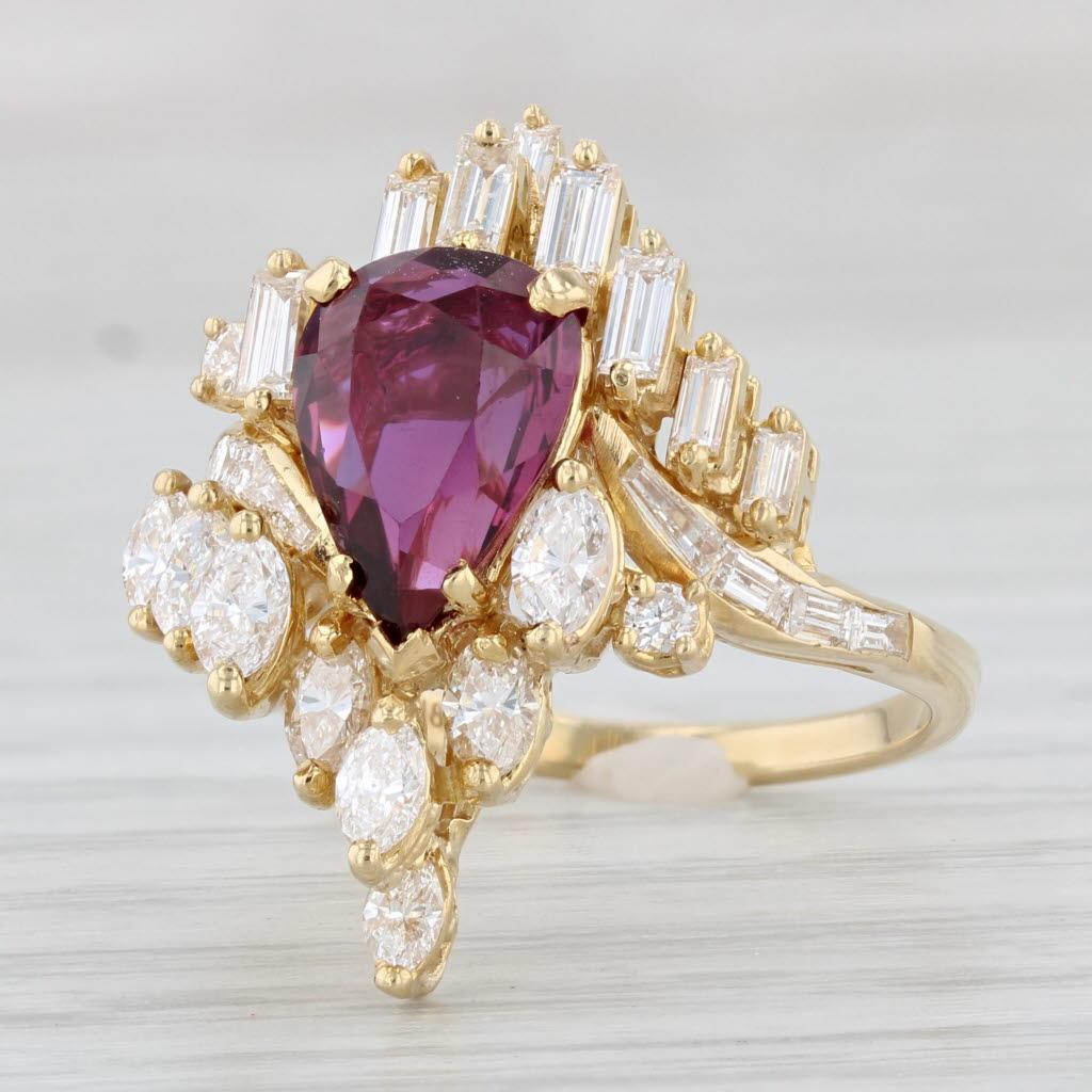 Gemstone Information:
- Natural Ruby -
Carats - 2ct (7.2 x 10 mm)
Cut - Pear
Color - Red
Treatment - Routinely Enhanced 
GIA # - 2235008241 

- Natural Diamonds - Total Carats - 1.48ctw
Marquise Brilliants
Total Carats - 0.72ctw
Color - F -