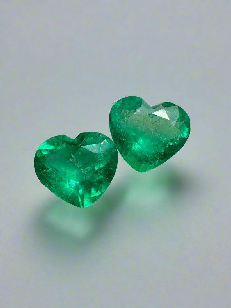 Stone: Emerald
Total Weight: 3.48-tcw
Shape: Heart Cut
Clarity: Transparent
Luster: Very Good
Color: Vivid Green
Measurements: 7.85mm x 8.79mm x 5.17mm // 7.70mm x 8.60mm x 4.66
Geographic Origin: Colombia
Treatment: Natural, Oil

No two emeralds