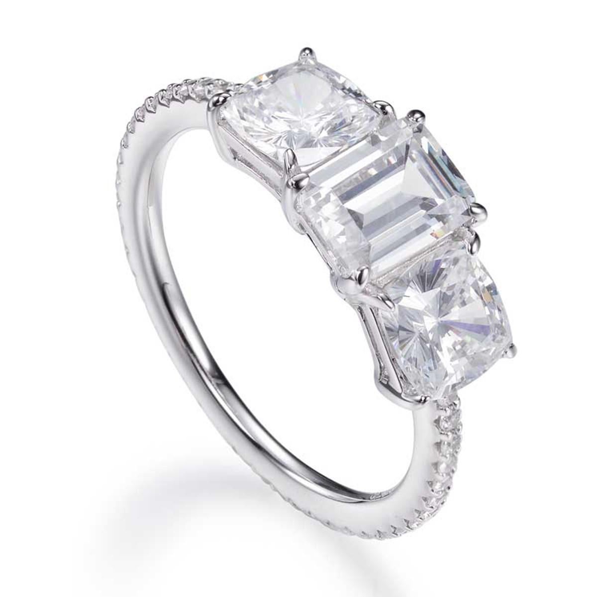 The dazzling emerald cut cubic zirconia in this breath-taking ring is flanked by two stunning princess cut cubic zirconia set into a band of sparkling brilliant cuts.

Composed of 925 sterling silver with a high gloss white rhodium finish.

Whether