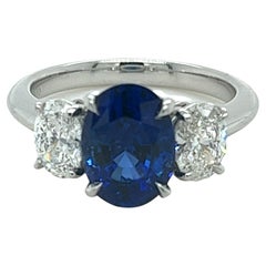 3.49 Carat Oval Ceylon Sapphire 
Diamond Three Stone Ring in Platinum
