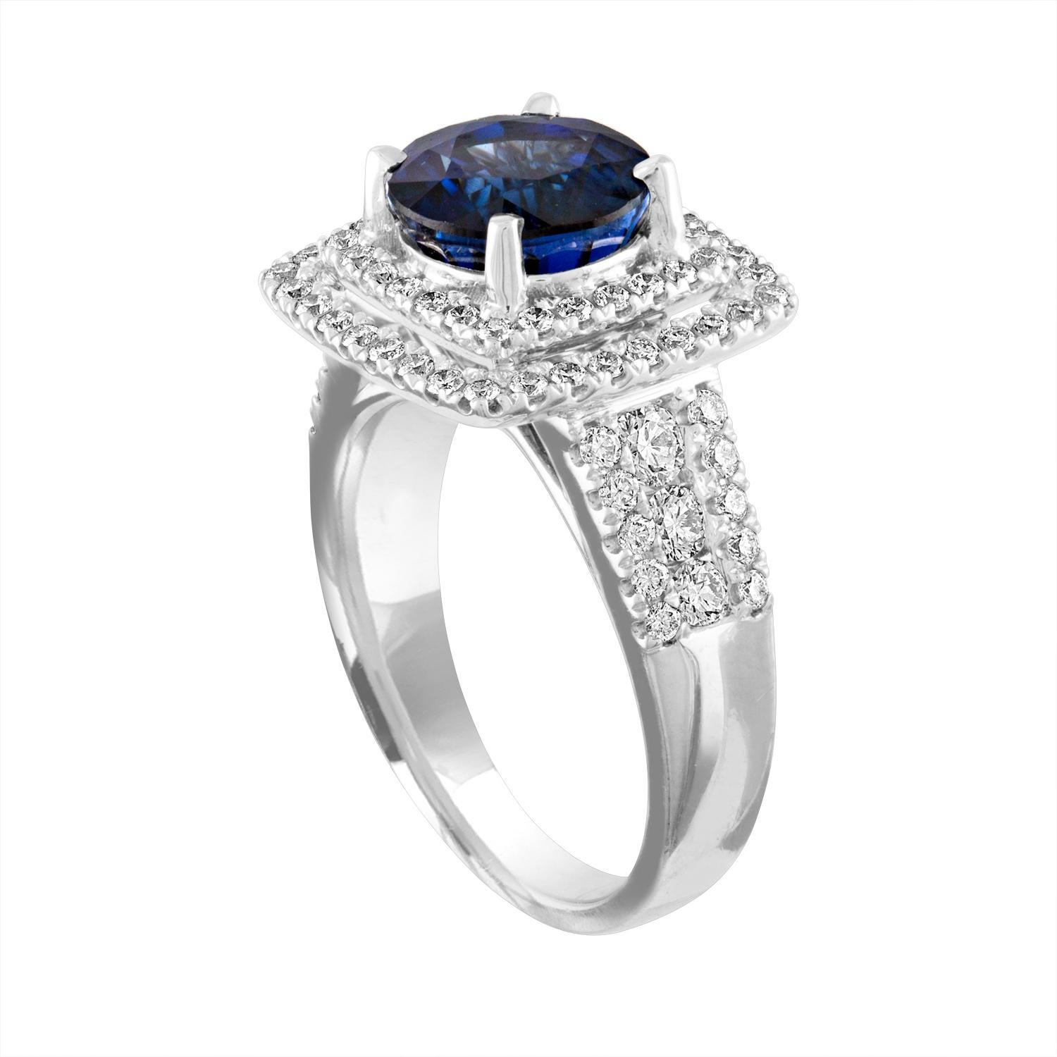 Exquisite Sapphire Surrounded by Double Diamond Halo
The ring is 18K White Gold
The Round Cut Sapphire is Blue 3.49 Carats
The Sapphire is Heated
There are 0.94 Carats in Diamonds F/G VS/SI
The ring is a size 6.75, sizable.
The ring weighs 7.6 grams