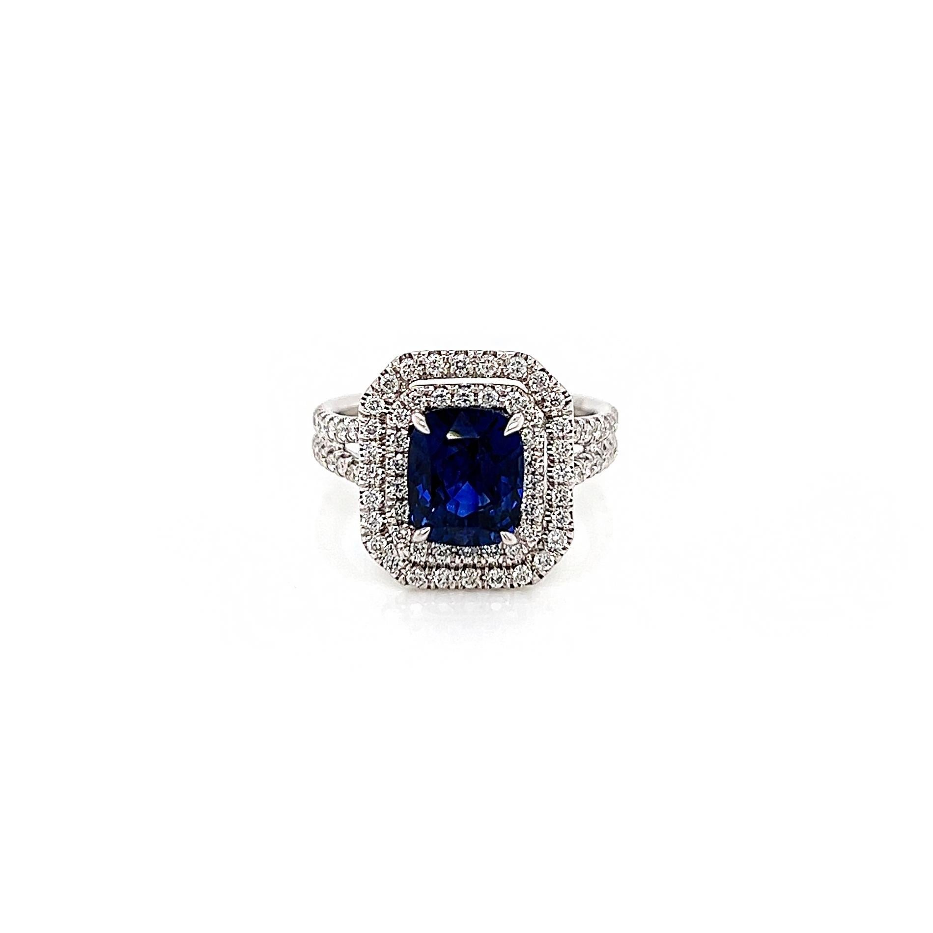 3.49 Total Carat Sapphire and Diamond Double-Halo Micro Pave-Set Ladies Ring

-Metal Type: 18K White Gold, Split Shank
-2.67 Carat Cushion Cut Natural Blue Sapphire
-0.82 Carat Round Natural Diamonds. F-G Color, VS-SI Clarity 

-Size 6.25

Made in