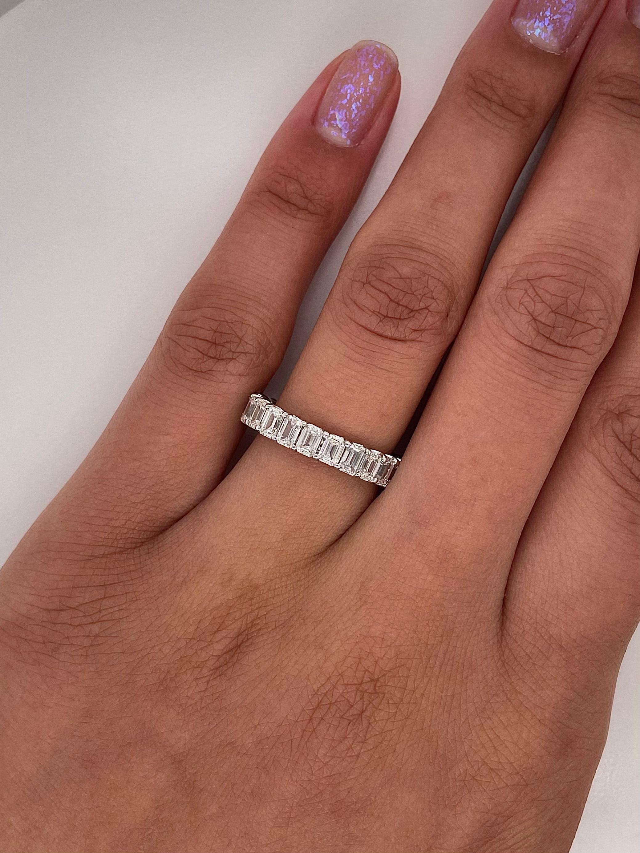 Ladies Diamond Eternity band carries 3.49 Total Carats of Emerald Cut Diamonds placed in Platinum.

Size: 6.0
Color: F
Clarity: VS

This shared prong style Eternity band was handmade by our jewelers in New York City
