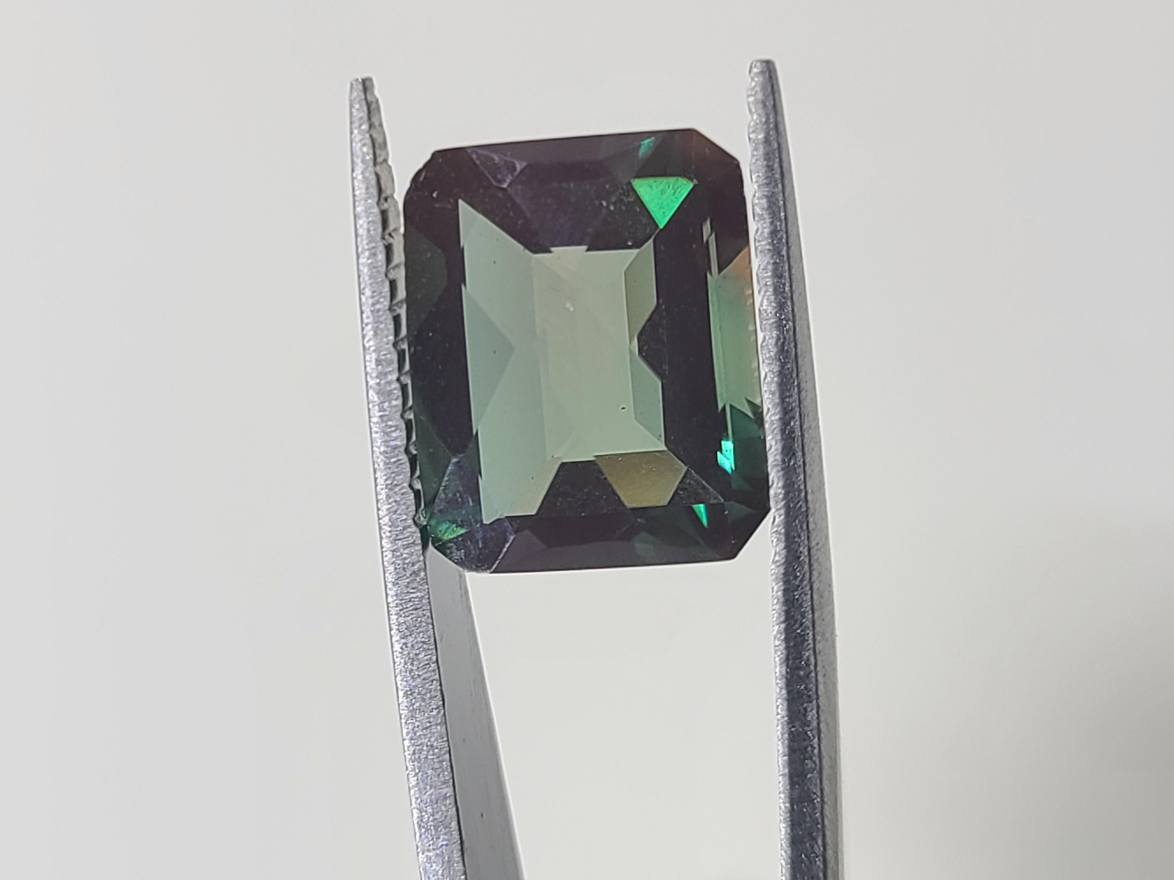 This gemstone comes from the estate of a private collector.
It's a emerald cut Green Andesine Labradorite.
It measures 11x9mm with a 5.2mm depth and it weighs 3.4 carats.
