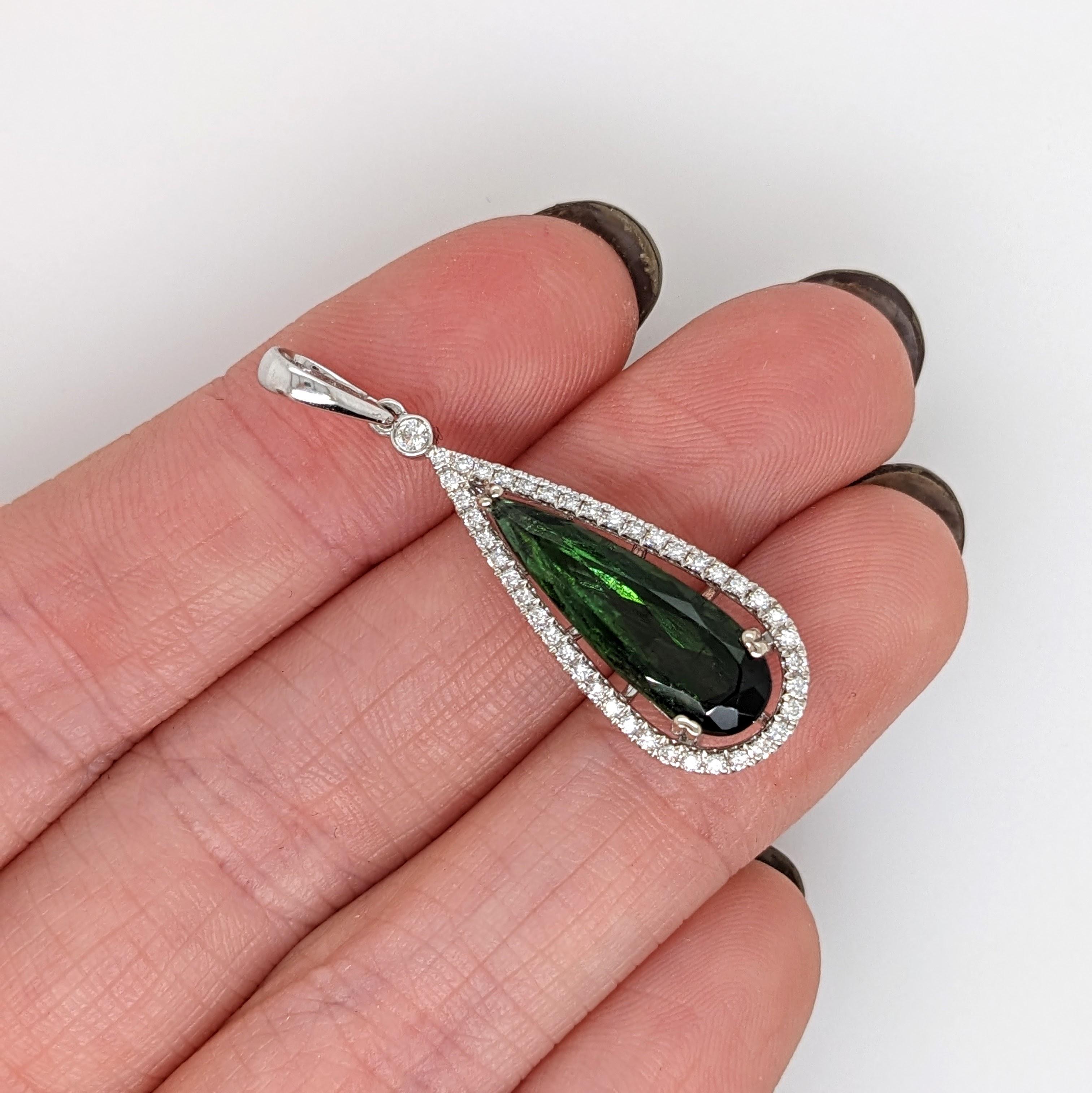 This beautiful pendant features a 3.40 carat pear shape green tourmaline with natural earth mined diamonds, all set in solid 14K gold. This pendant can be a lovely October birthstone gift for your loved ones! 

Specifications

Item Type: