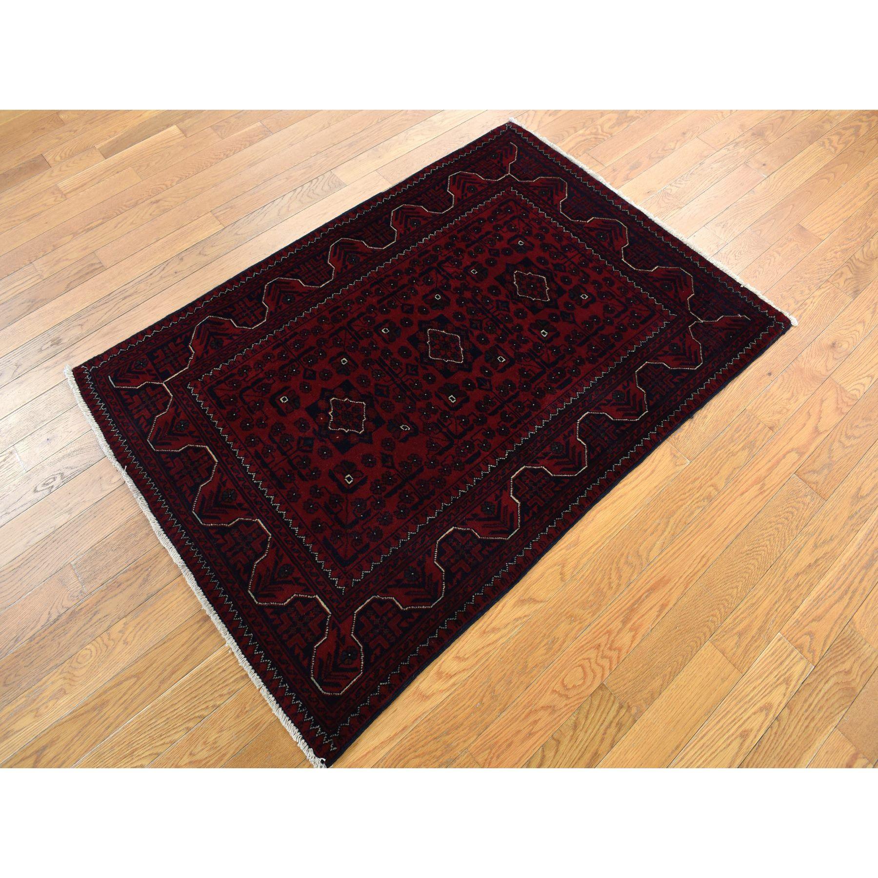Chocolate Cosmos Red, Afghan Khamyab, 100% Wool, Hand Knotted, Oriental Rug
Primary materials: Wool
Latex: No Pile 
height: 0.25 Inches
Style: Traditional
Primary color: Red
Secondary colors: Black, White, Brown, Green
Pattern: Oriental