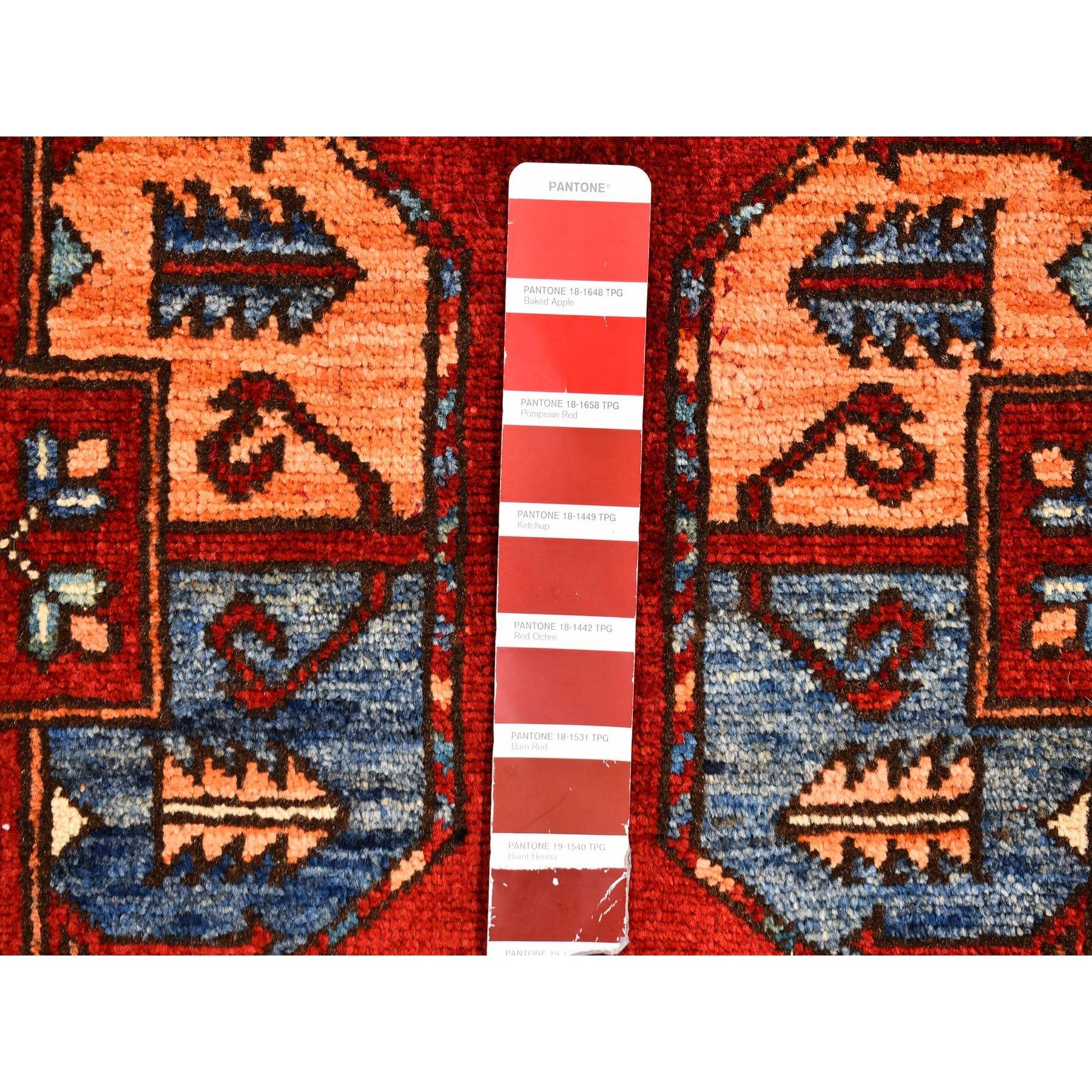 This is a truly genuine one-of-a-kind Red 100% Wool Geometric Afghan Ersari with Elephant Feet Design Hand Knotted Oriental Rug. It has been woven for months and months in the centuries-old Persian weaving craftsmanship techniques by expert