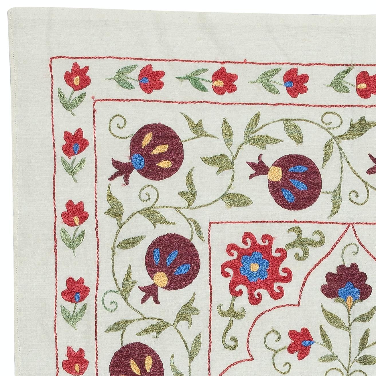 Introducing our exquisite new suzani hand embroidered wall hanging, a captivating piece that combines ancient craftsmanship with modern artistry. This embroidered cloth is not just a suzani throw, but a remarkable suzani wall hanging that will