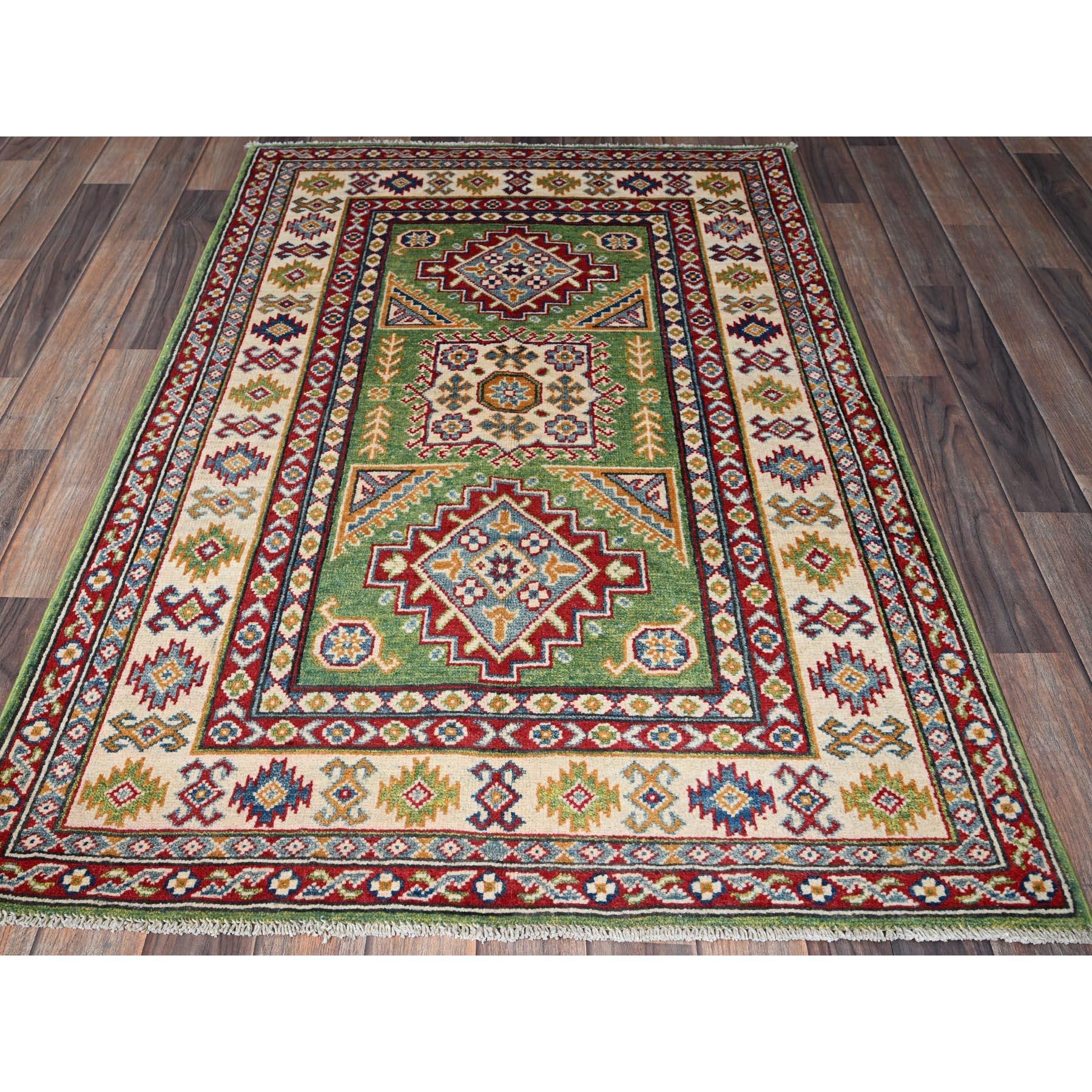 Swamp Green, Kazak with Geometric Medallions Design, Vegetable Dyes, Hand Knotted, Denser Weave, Pure Wool, Oriental Rug
Primary materials: Wool
Latex: No Pile 
height: 0.25 Inches
Style: Traditional
Primary color: Green
Secondary colors: Red, Light