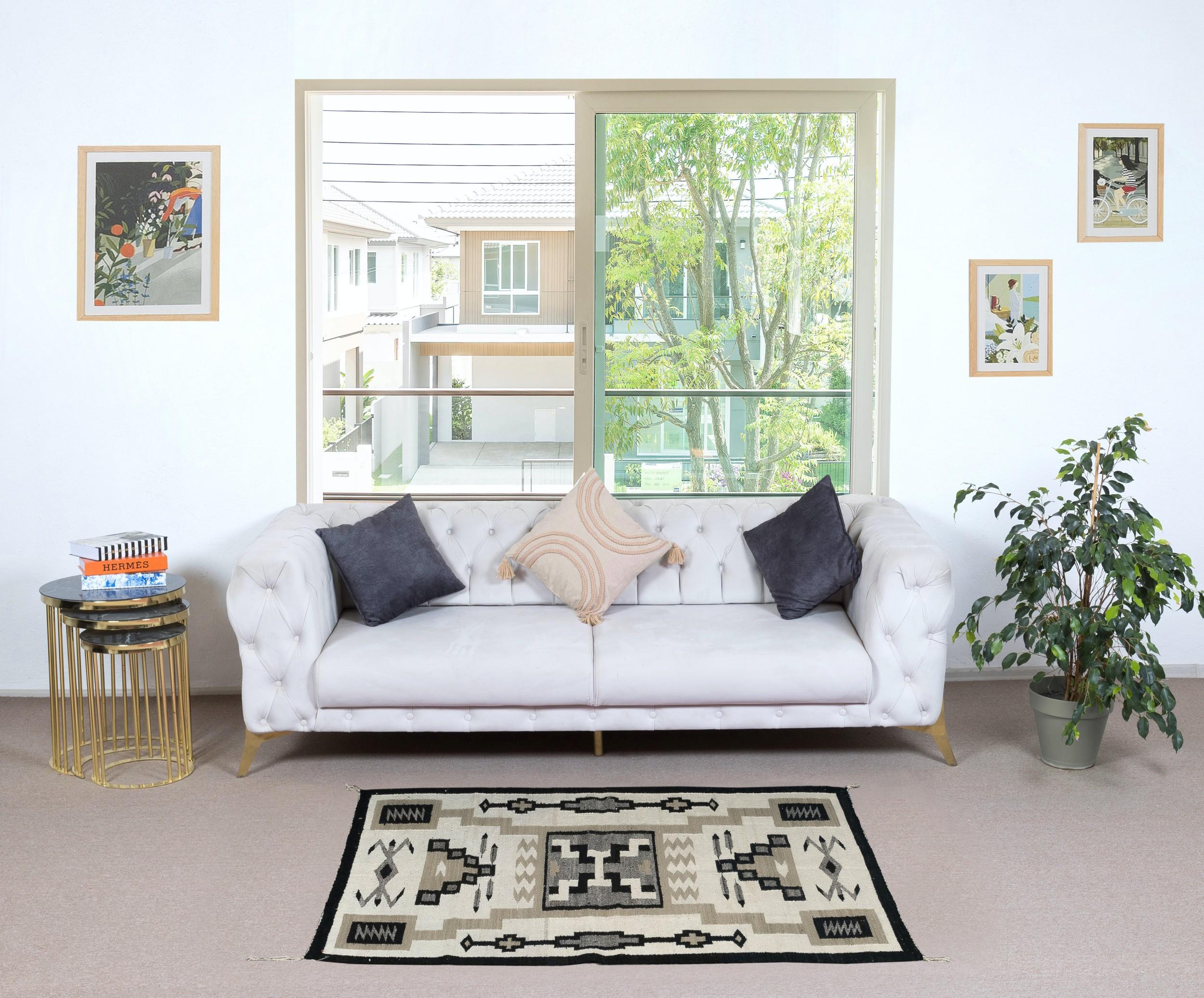 Embark on a journey through Turkish tradition with this exquisite vintage handwoven Turkish wool kilim rug, a testament to the enduring craftsmanship of Anatolian artisans. Woven with meticulous care and attention to detail, this kilim rug