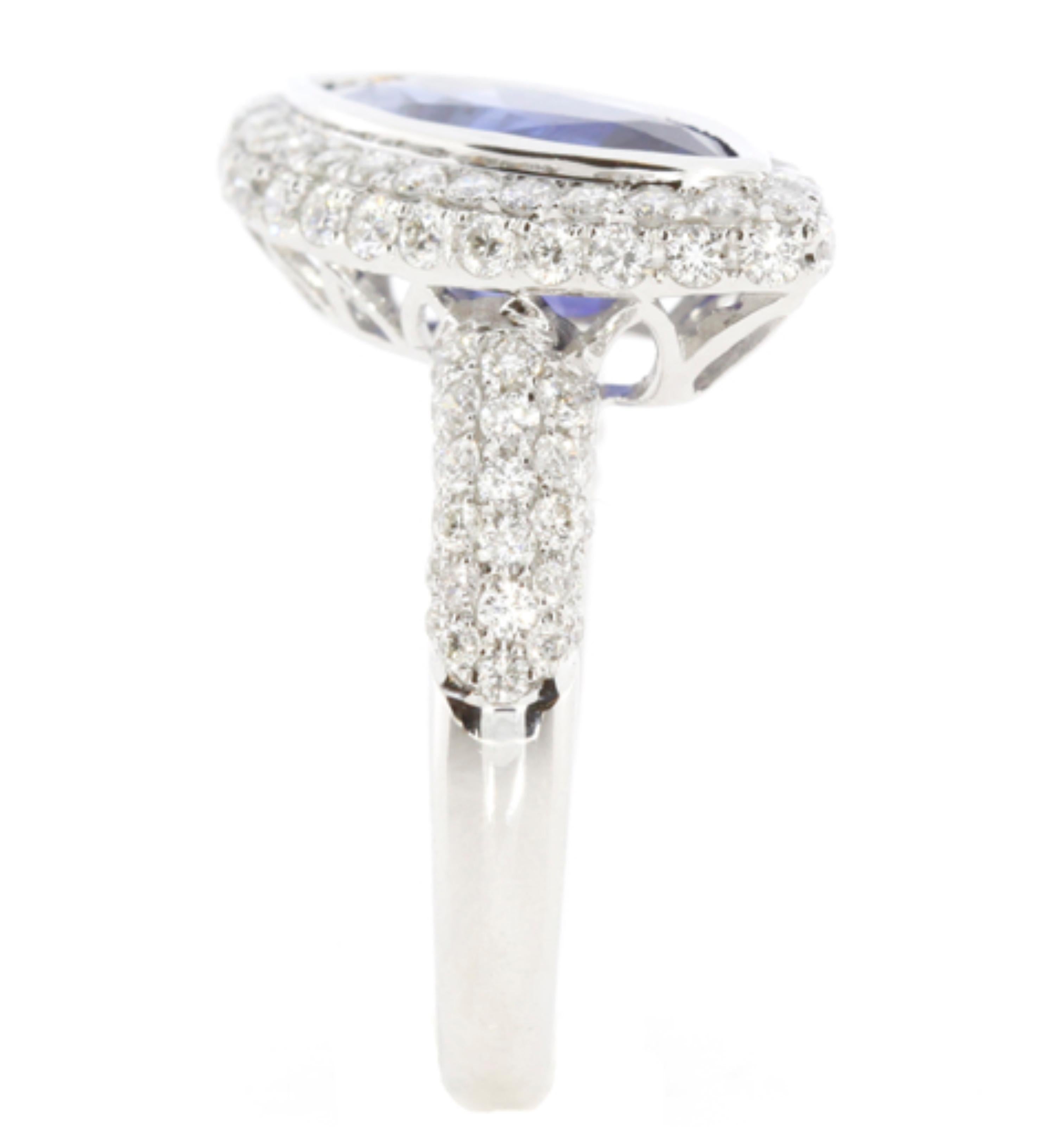 3.5 carat ring centered by a  blue marquise sapphire weighing 2.36 carats. This ring made by Shimon's Creations features 1.14 Carat of shimmering white diamonds and 18k white gold.

Color Stone And Diamond Breakdown:
White Diamonds: 1.14 carats