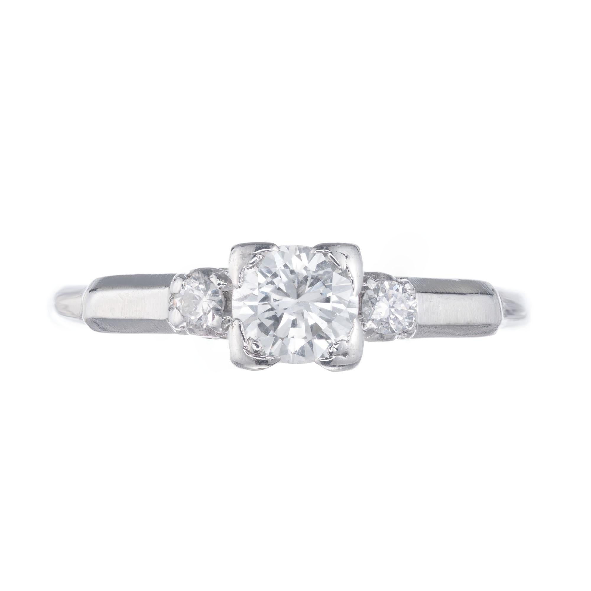 Art Deco 1940’s three-stone diamond engagement ring. Handmade platinum setting with a .35ct center diamond and two round accent diamonds. 

1 center diamond: approx. total weight .35cts, F, VS
2 Side diamonds: approx. total weight .08cts, F, VS
Size