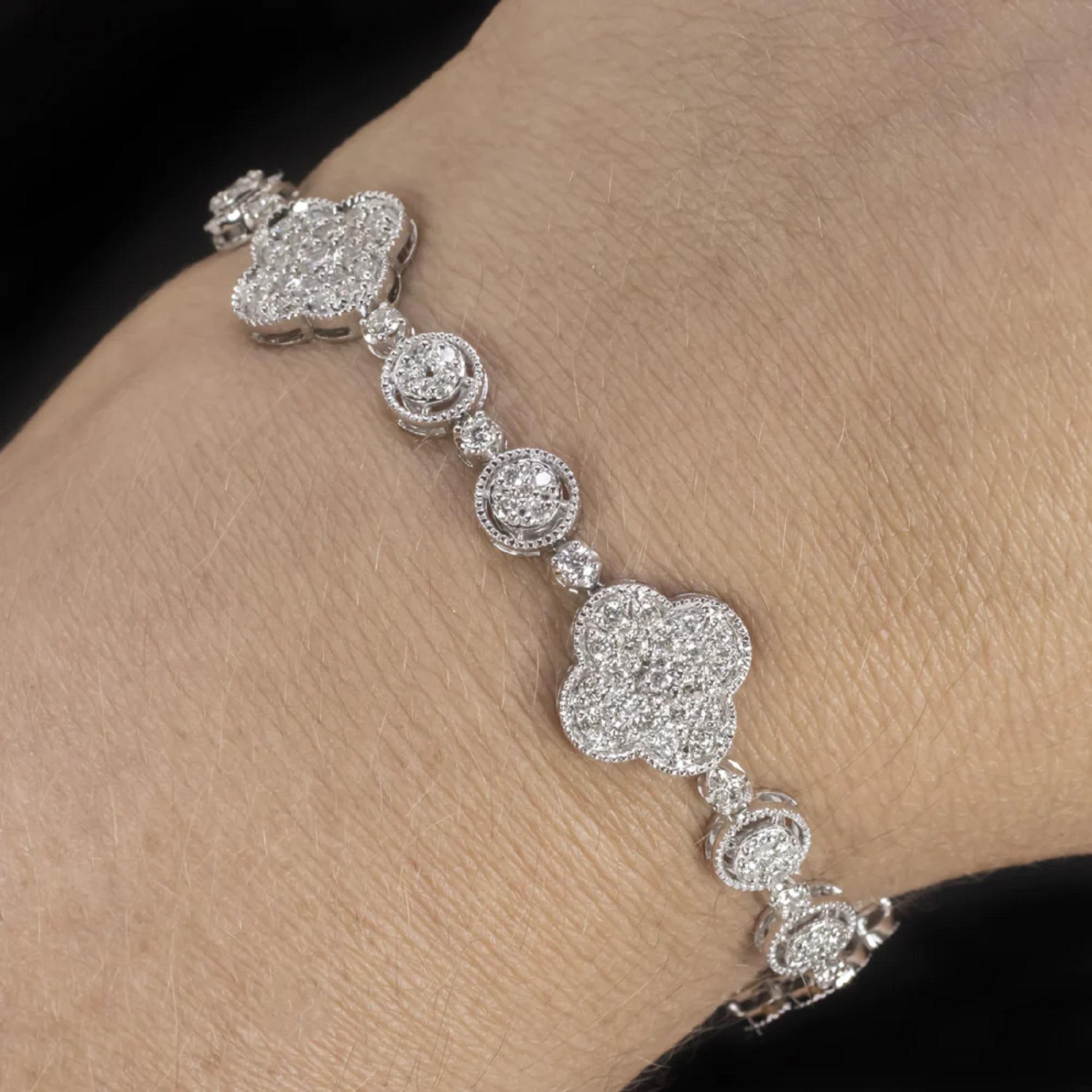 diamond bracelet has a stunning, large and glamorous look! The face is made up of round and clover shape clusters, and the lariat design clasp creates an elegant, dangling tassle

Highlights:

- 3.5 carats of bright white and eye clean diamonds

-