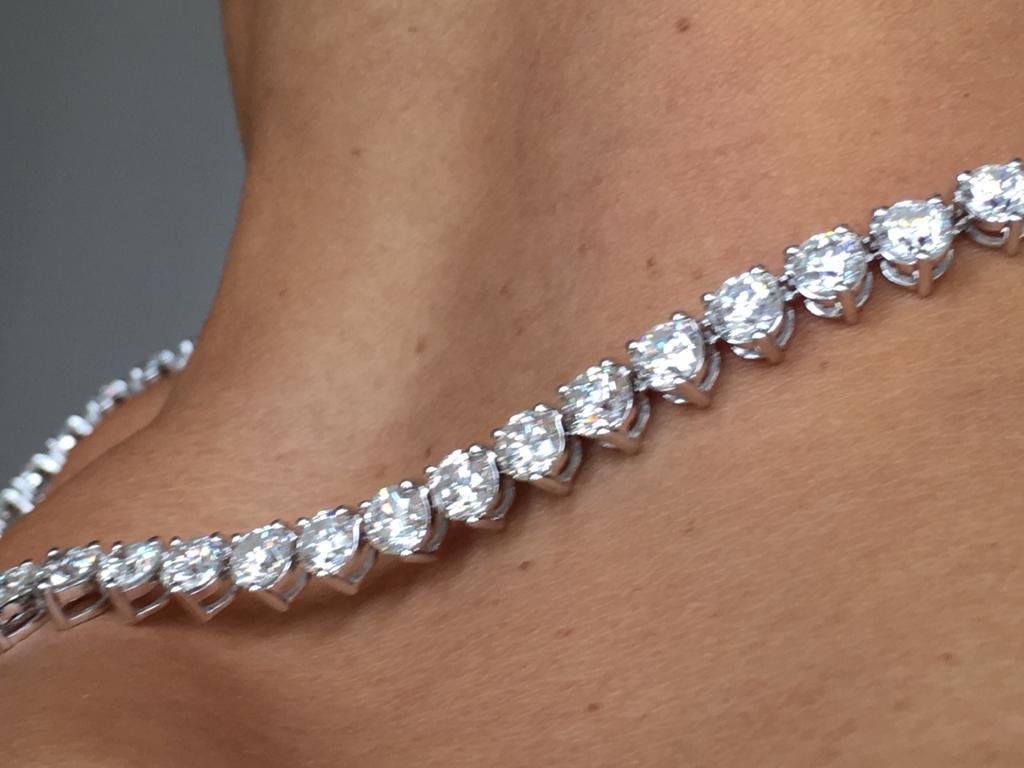 This huge and magnificent Riviera Tennis Necklace has a total diamond weight of 35.00 Carat in delightfully graduated Round Brilliant Cut White Diamonds Colour G/H clarity SI. Each stone has three prongs setting with open gallery all set in 18 Karat
