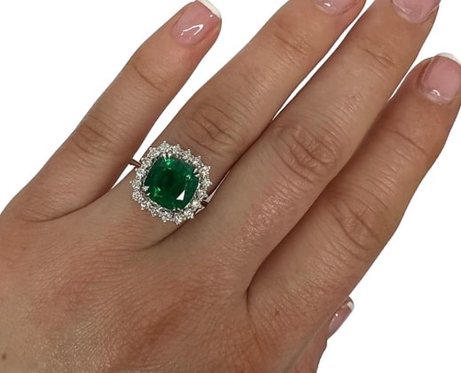 Emerald Weight: 3.56 CTs, Measurements: 10x10 mm, Diamond Weight: 0.47 CTs (2.2mm), Metal: 18K White Gold, Gold Weight: 6.11 gm, Ring Size: 7, Shape: Cushion, Color: Green, Hardness: 7.5-8, Birthstone: May