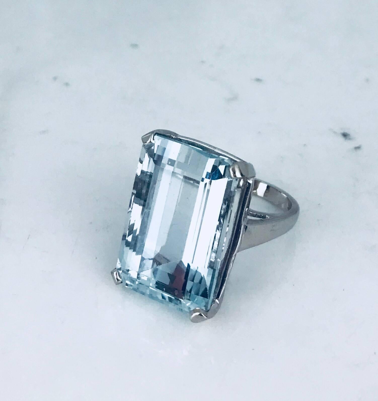 One 18 karat white gold Aquamarine Ring. This Retro style is from the 1950's and is approximately 35 carats in size. The diameter of the gemstone is 22.45 x 15.79 x 12.00 millimeters. The color is of a fine, powder blue hue set in a 4-prong setting.