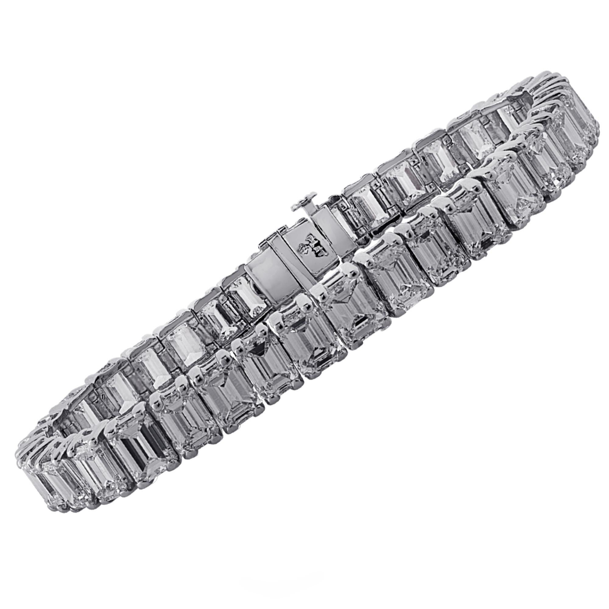 Exquisite diamond tennis bracelet crafted in platinum, showcasing 34 stunning emerald cut diamonds weighing approximately 35 carats total, I color, VS clarity, set in a seamless sea of eternity. This superb bracelet measures 8 mm in width and 6.75