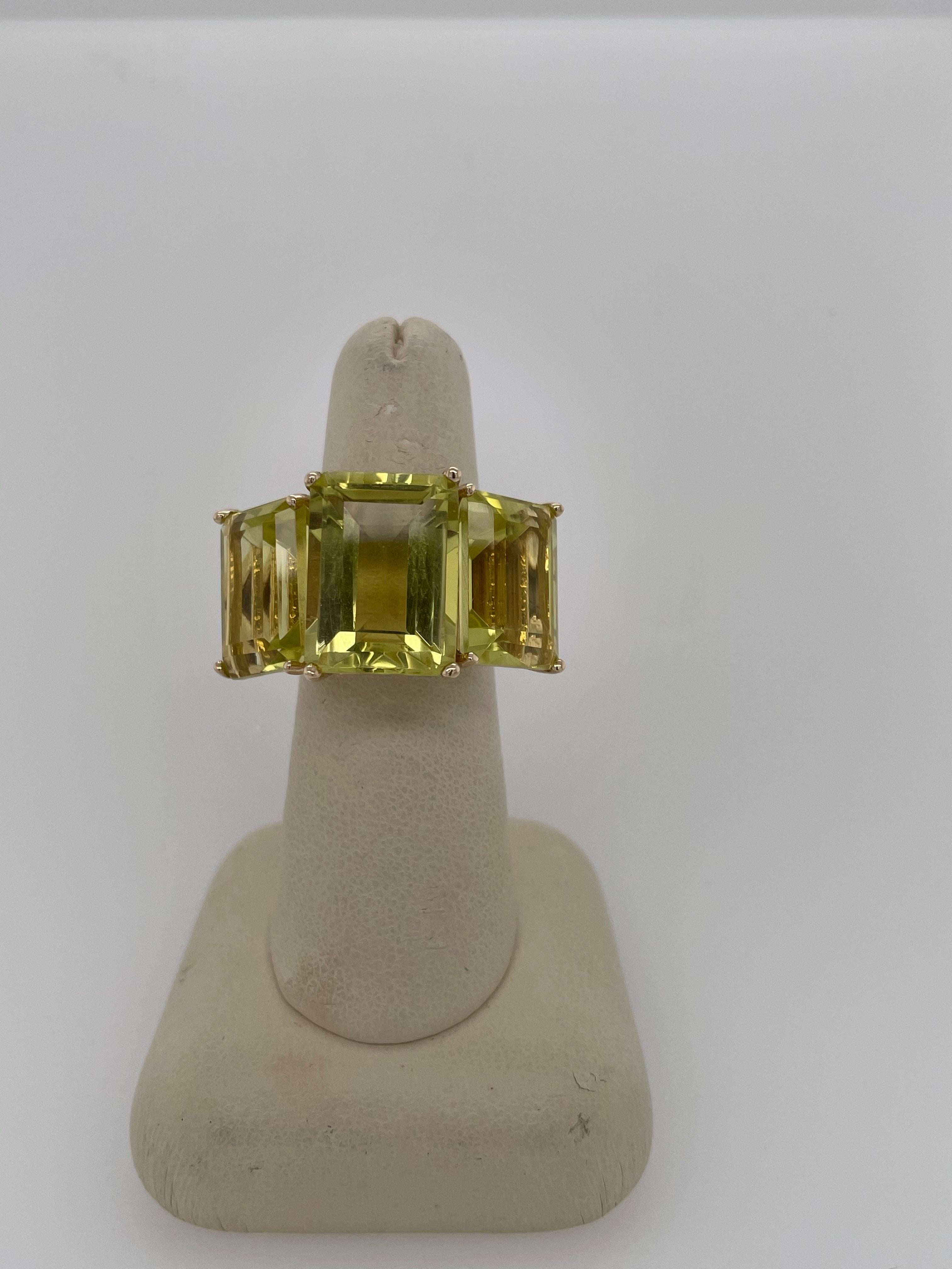 Stunning 35 carat Lemmon Citrine Cocktail Ring!  This ring is sure to add some sparkle and pizzaz to your life! This ring is set in 18K yellow gold adorned with three stones: The center stone approximately 14 carats, two side stones that are