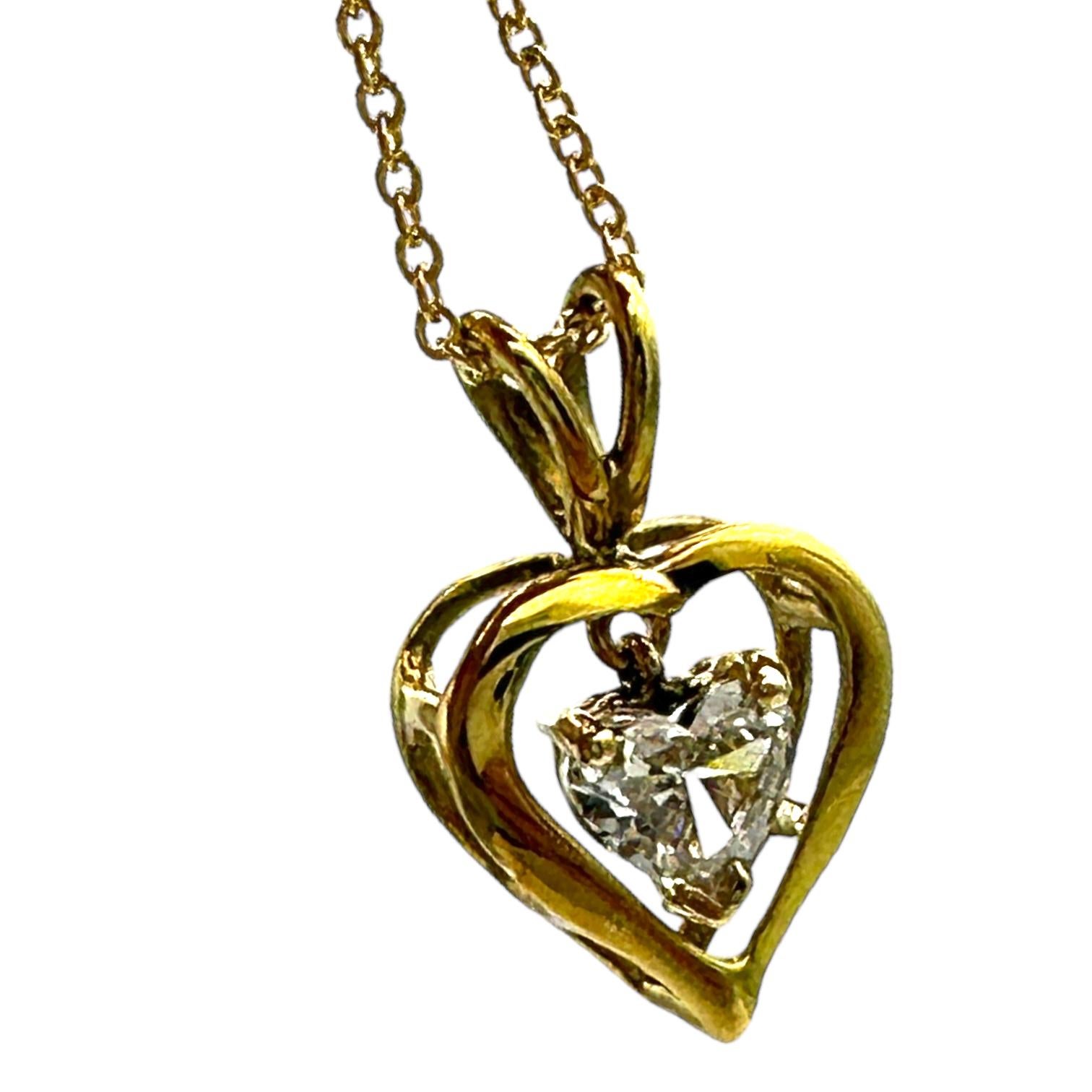 Floating Heart Diamond Pendant showcases a heart-shaped diamond! The diamond weight is .35 Carats. 
The pendant is very sweet, with the diamond dangles inside the larger heart, which measures 3/4 