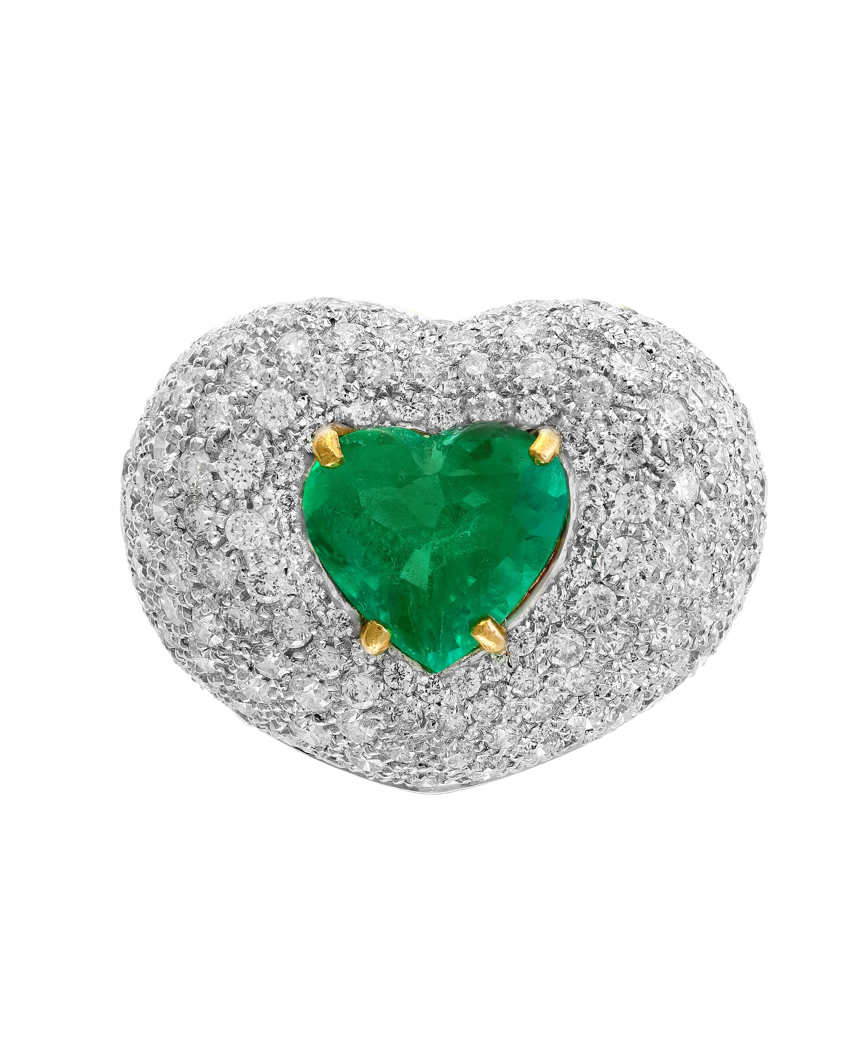 A classic, Cocktail ring 
3.5 Carat  Colombian Emerald and Diamond Ring, Estate with  no color enhancement.
Gold: 18 carat white gold , Weight: 16 gram Size of the ring 6.5
 Diamonds: approximate 7.5 Carat Round brilliant  cut diamonds
Emerald: 