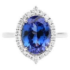 Anillo de compromiso de cóctel con halo de diamantes tanzanita AAA natural de 3,5 quilates y oro de 18k
