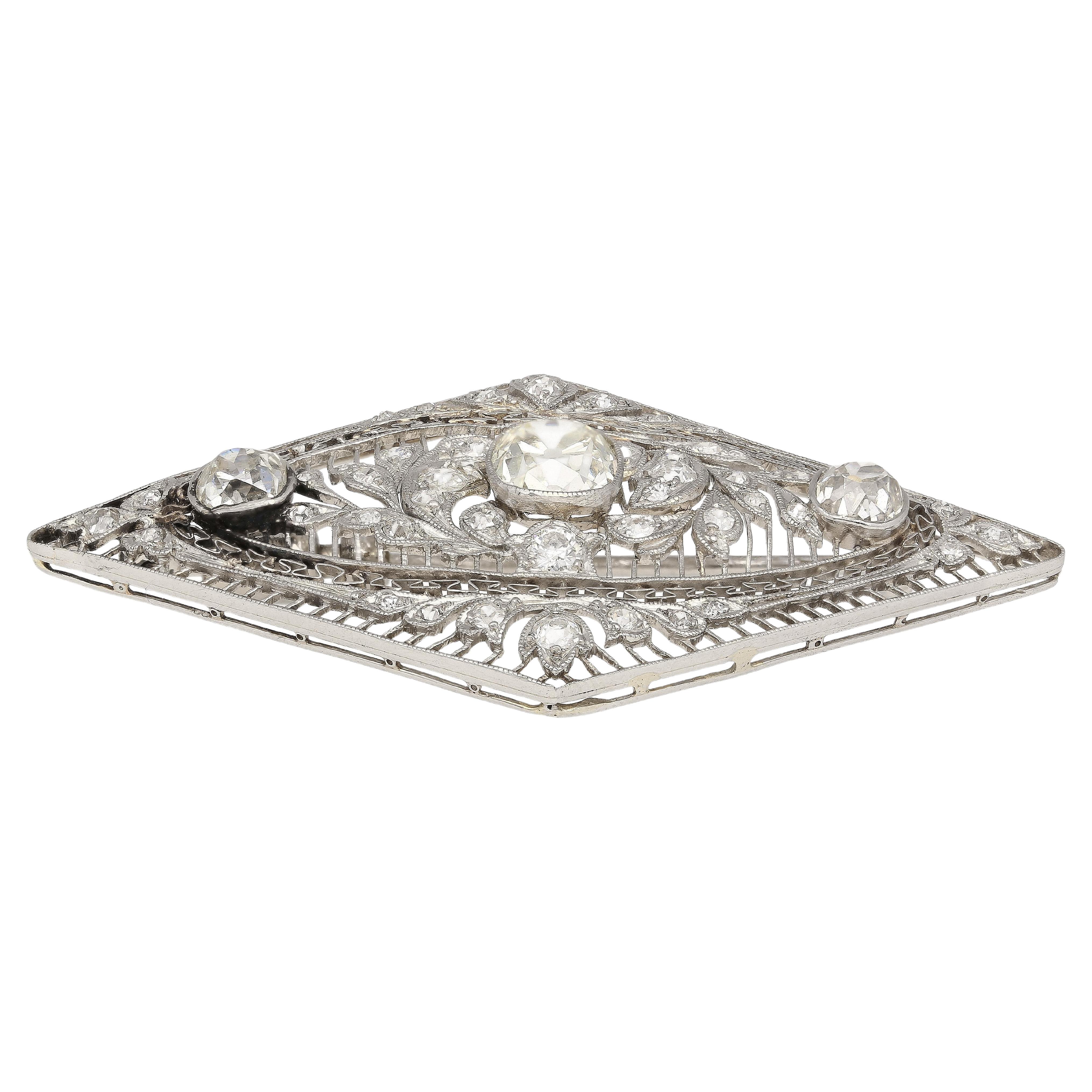 3.5 Carat Old European Cut Art Deco Diamond Brooch in Textured Filigree Platinum / Vintage Art Deco Old Euro Diamond Shaped Pin

A truly inspiring pin, featuring 3 Old European-cut white diamonds with a 3.50 carat weight total. These three diamonds